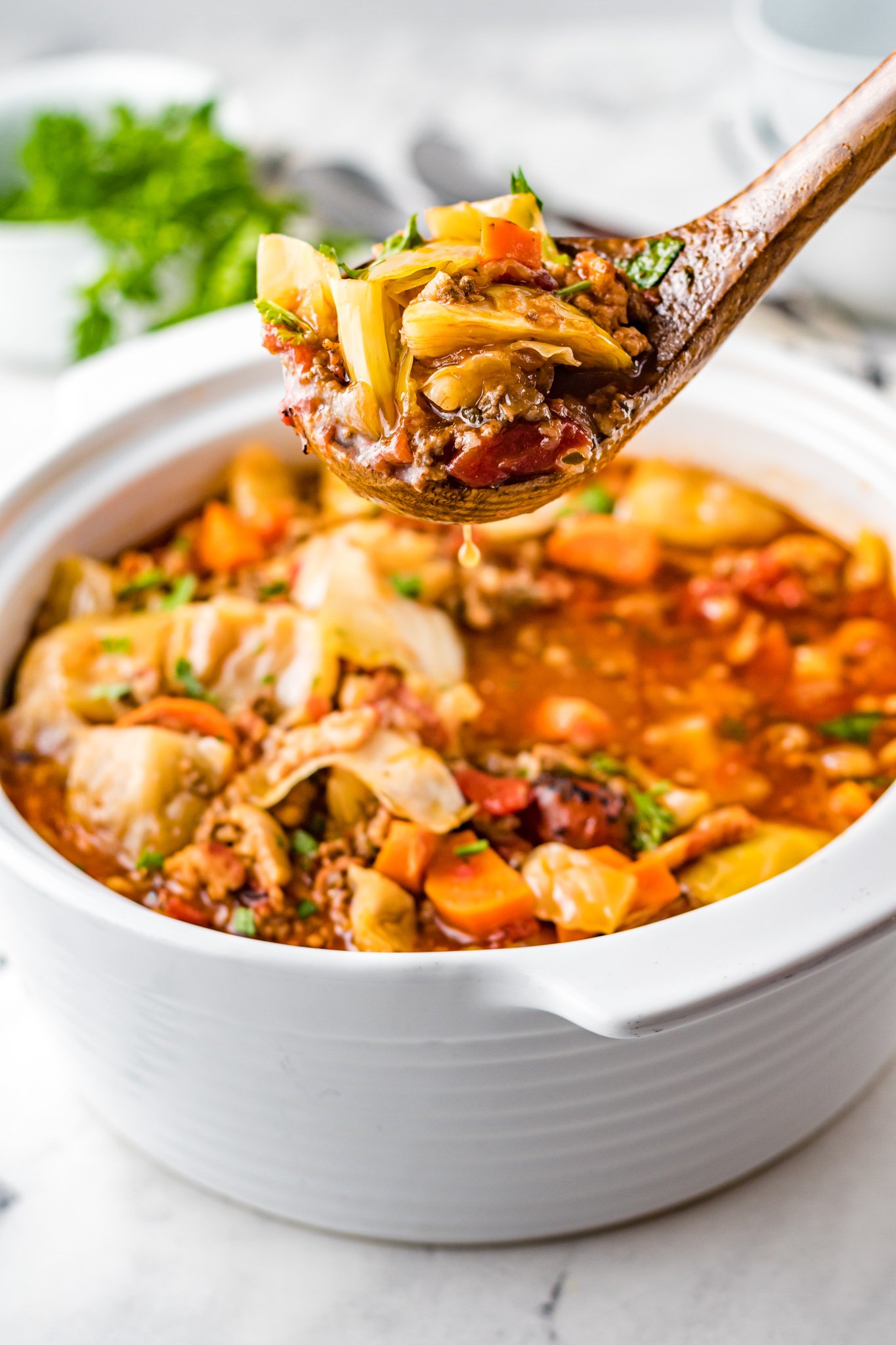 Cabbage Roll Soup in a white pot. 