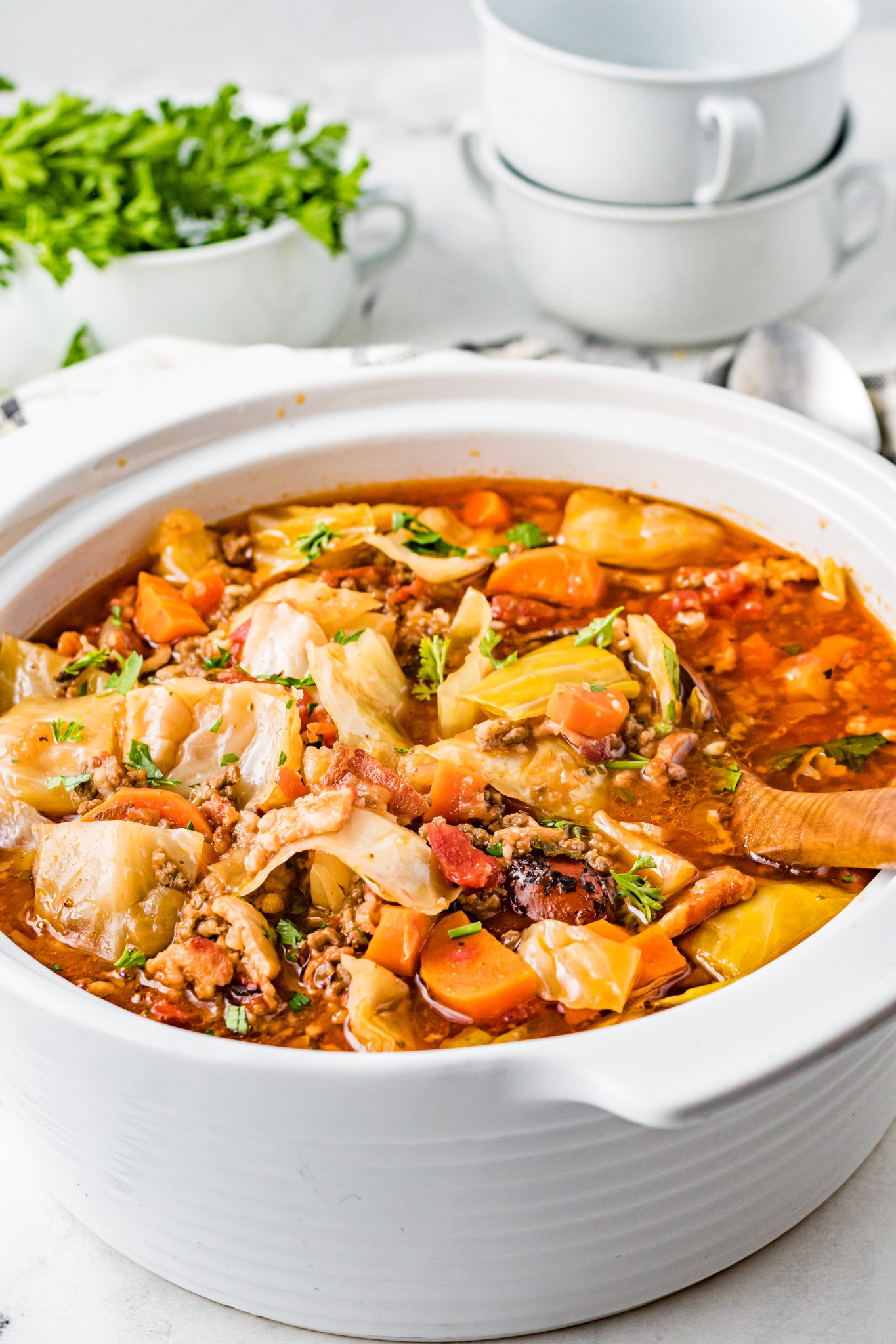Cabbage Roll Soup with wooden spoon. 