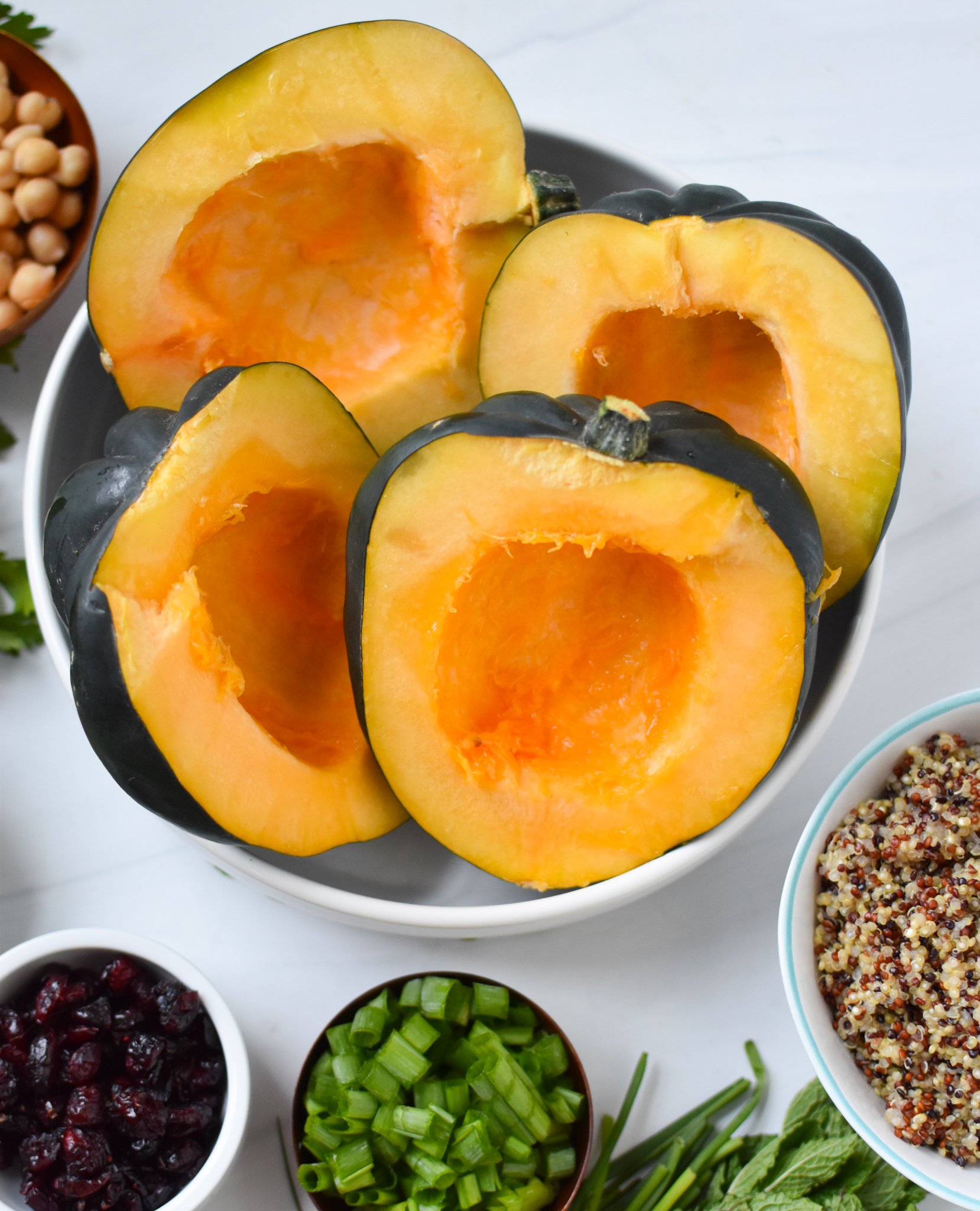 Mediterranean Stuffed Acorn Squash cut in a bowl.
