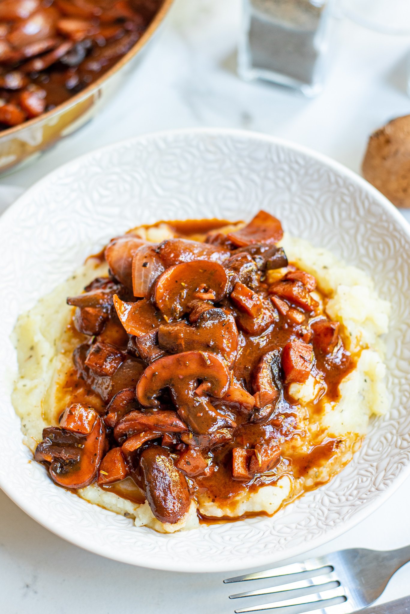 Mushroom Bourguignon on white plate.