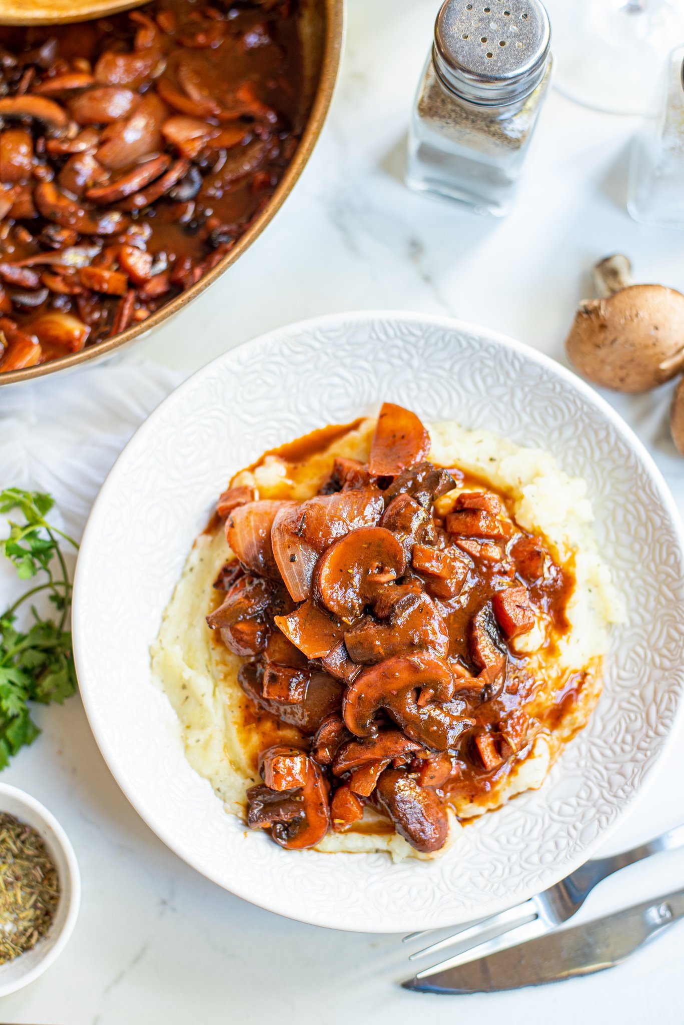 Mushroom Bourguignon in white plate. 