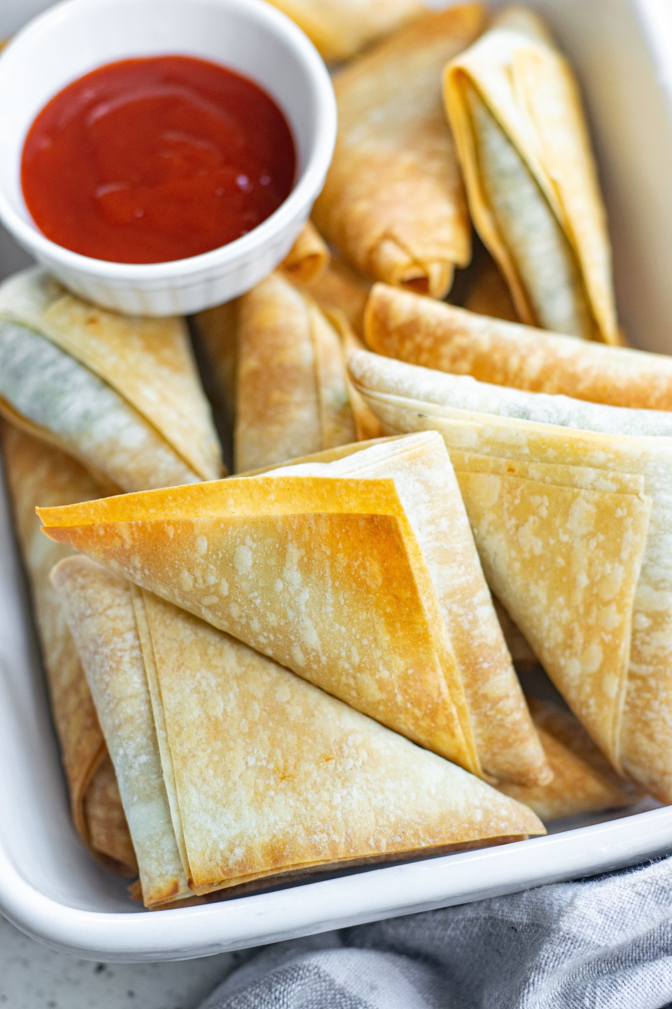 Spanakopita Triangles Recipe with sauce.