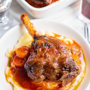 Braised Lamb Shank Recipe in a white bowl.