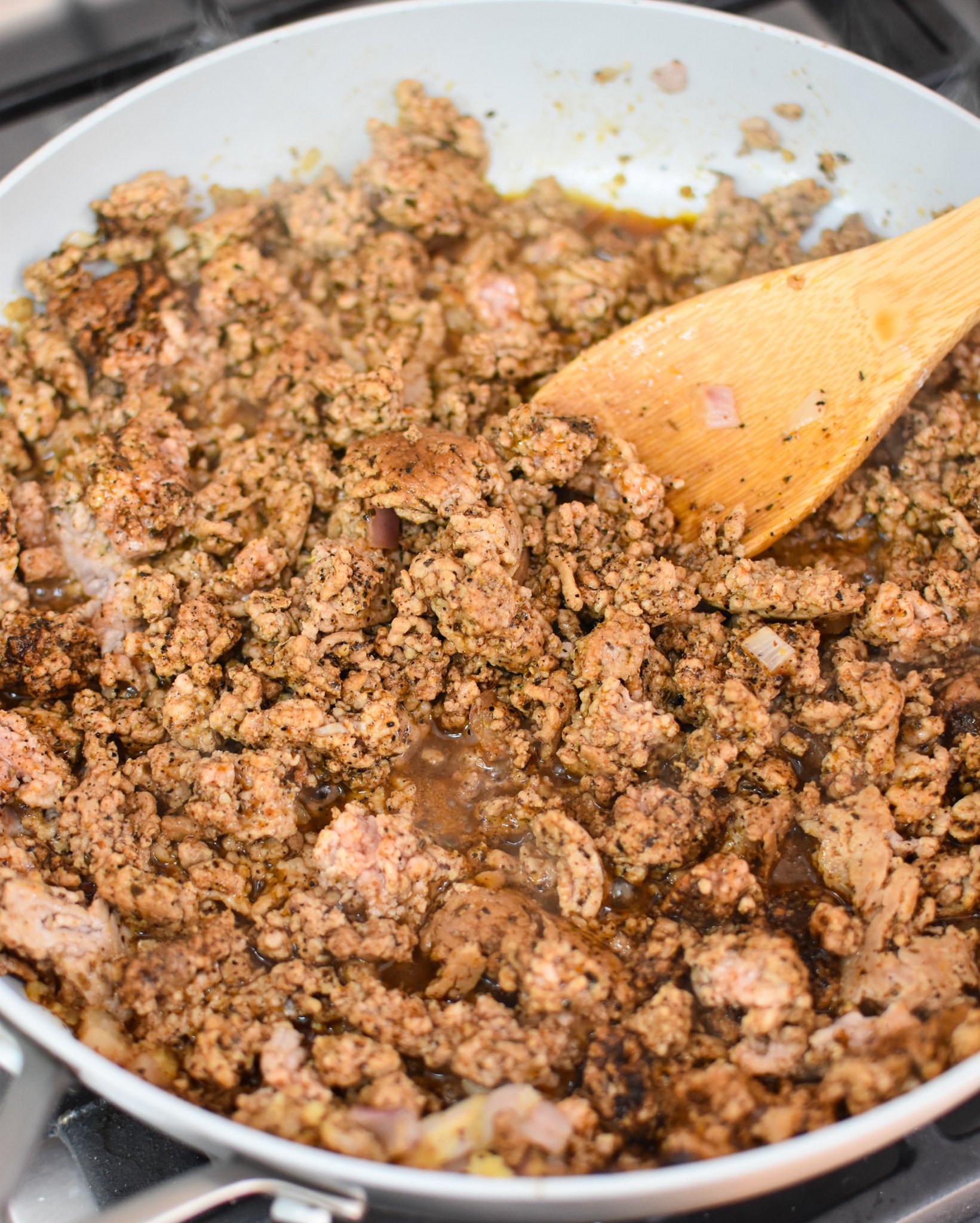 Air Fryer Pork Taquitos pork in a skillet.