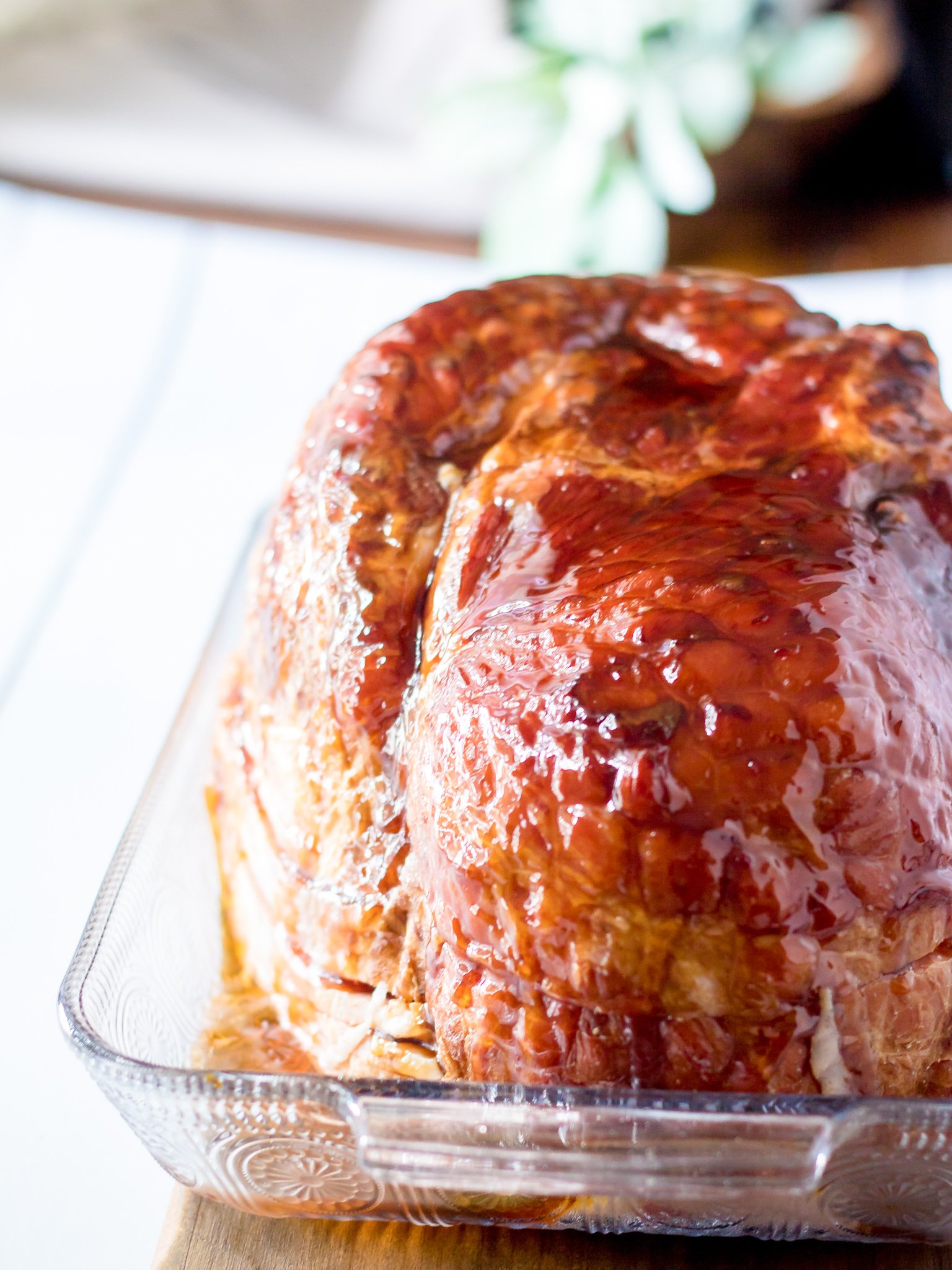 Apple Cider Glazed Ham Recipe ham on cutting board.