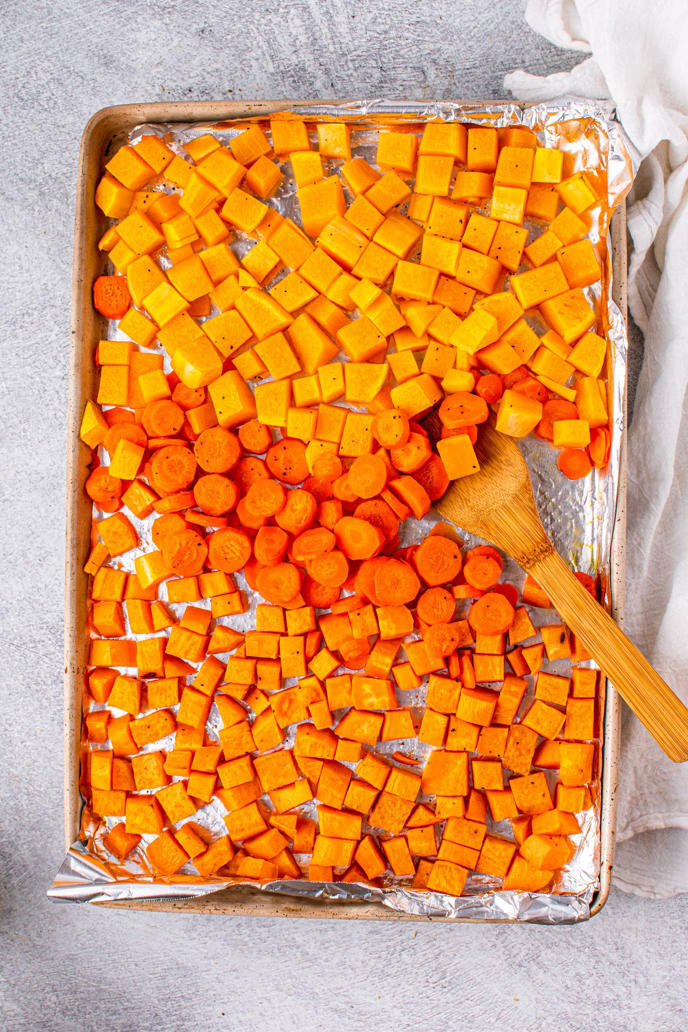 Butternut Squash and Sweet Potato Soup vegetables on a baking sheet.