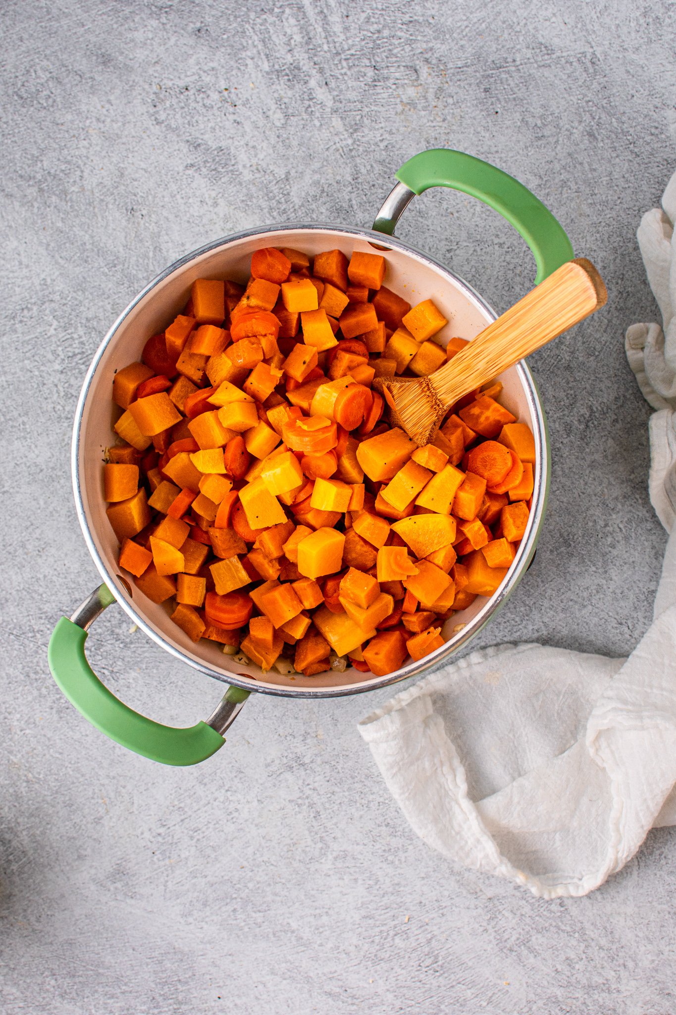 Butternut Squash and Sweet Potato Soup with vegetables in pot.