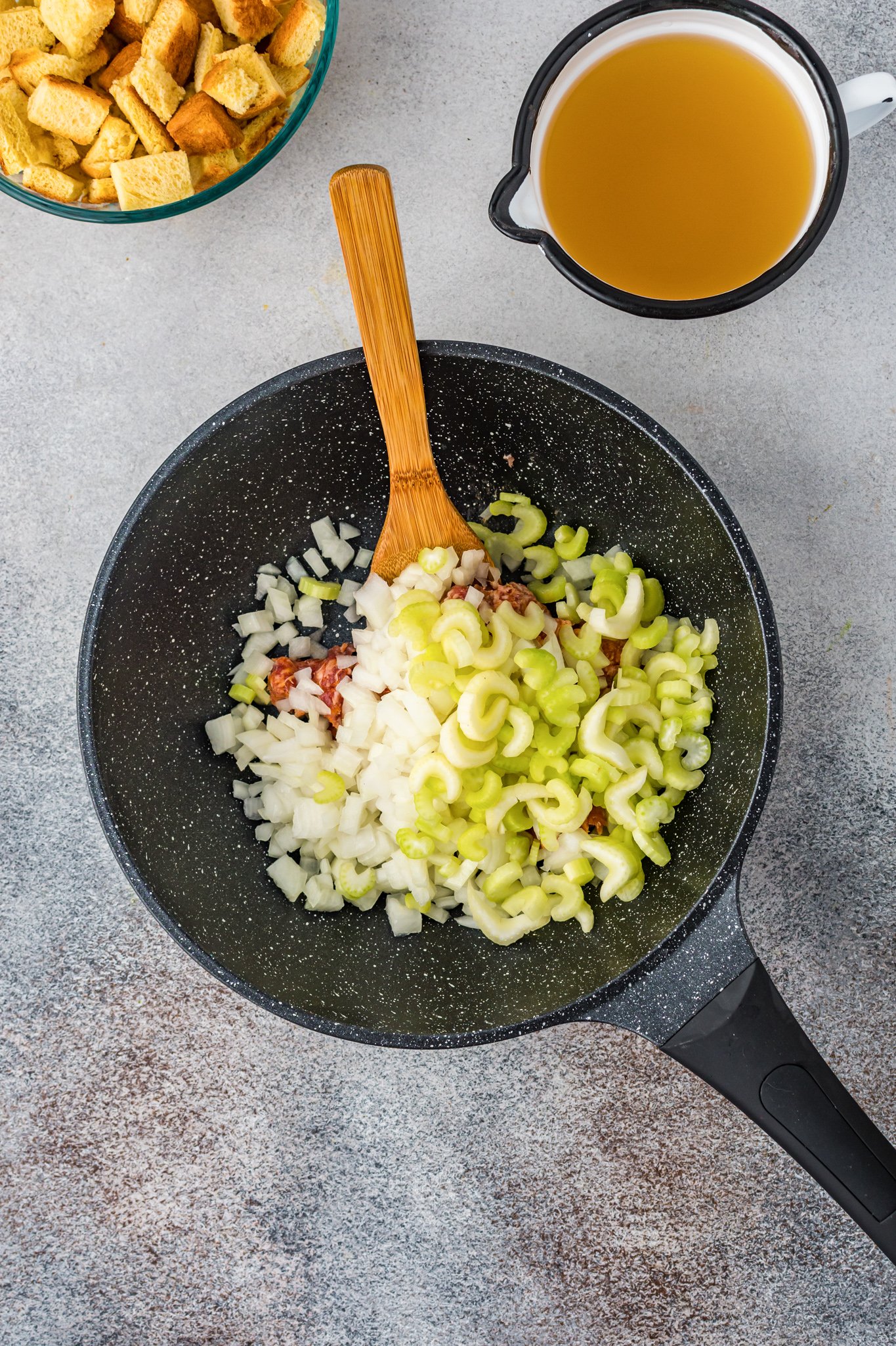 Butternut Squash Stuffing sausage and celery in a skillet. 