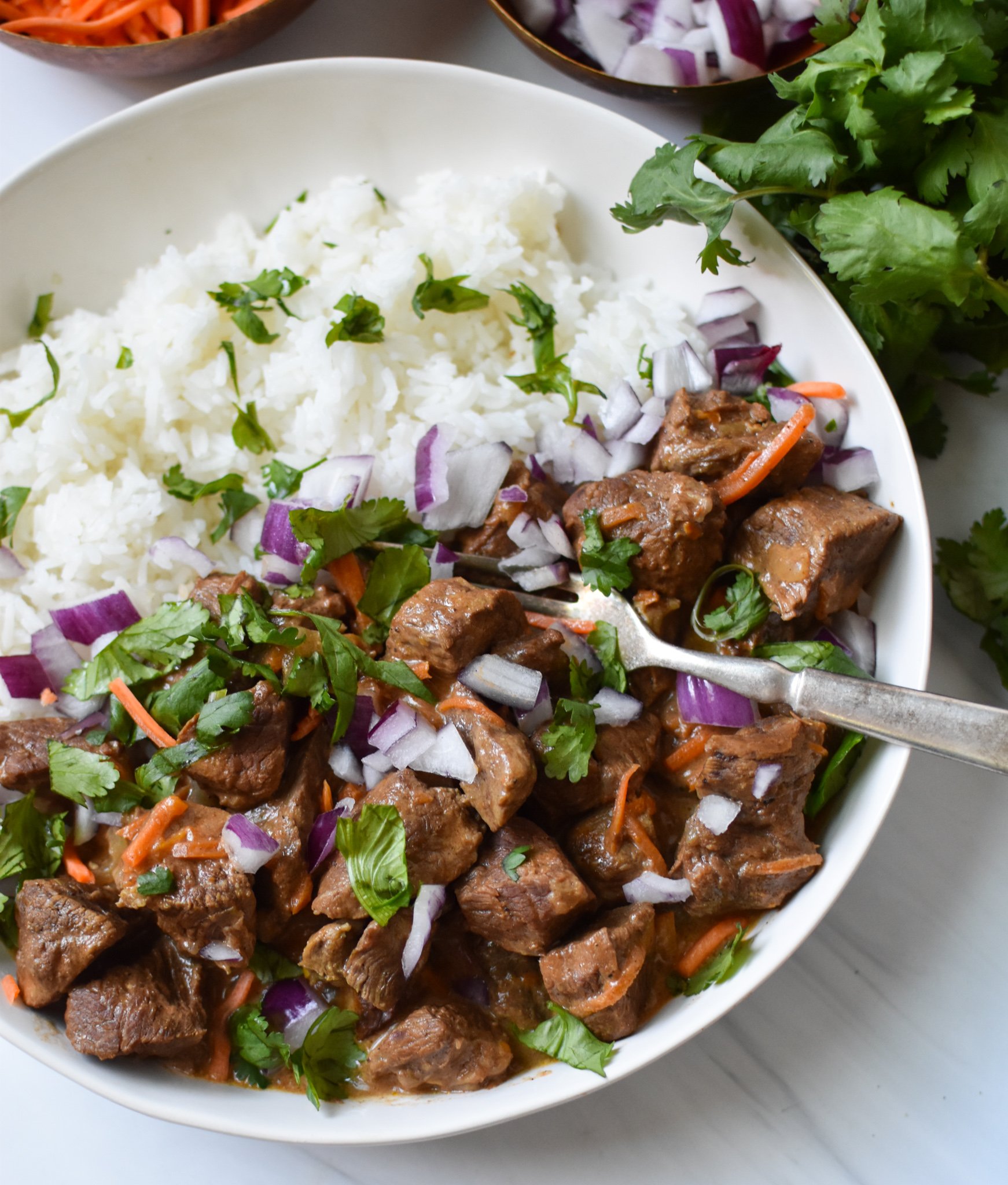 Slow Cooker Beef Curry with fork.