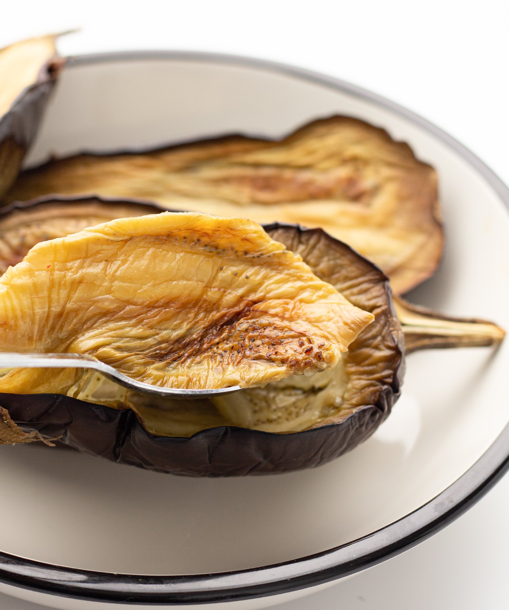 Air Fryer Eggplant scooping out the flesh.