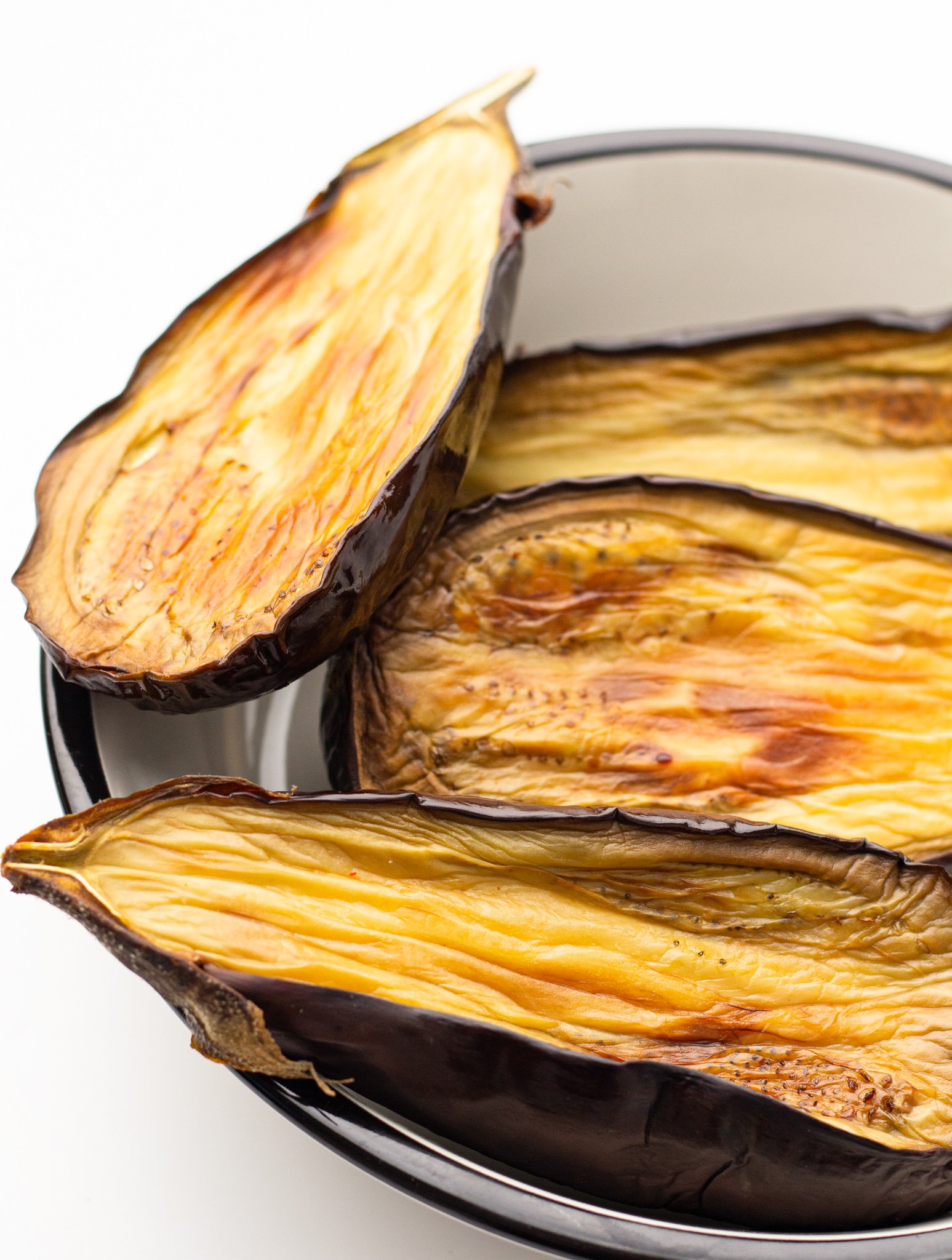 Air Fryer Eggplant in the air fryer cooking. 