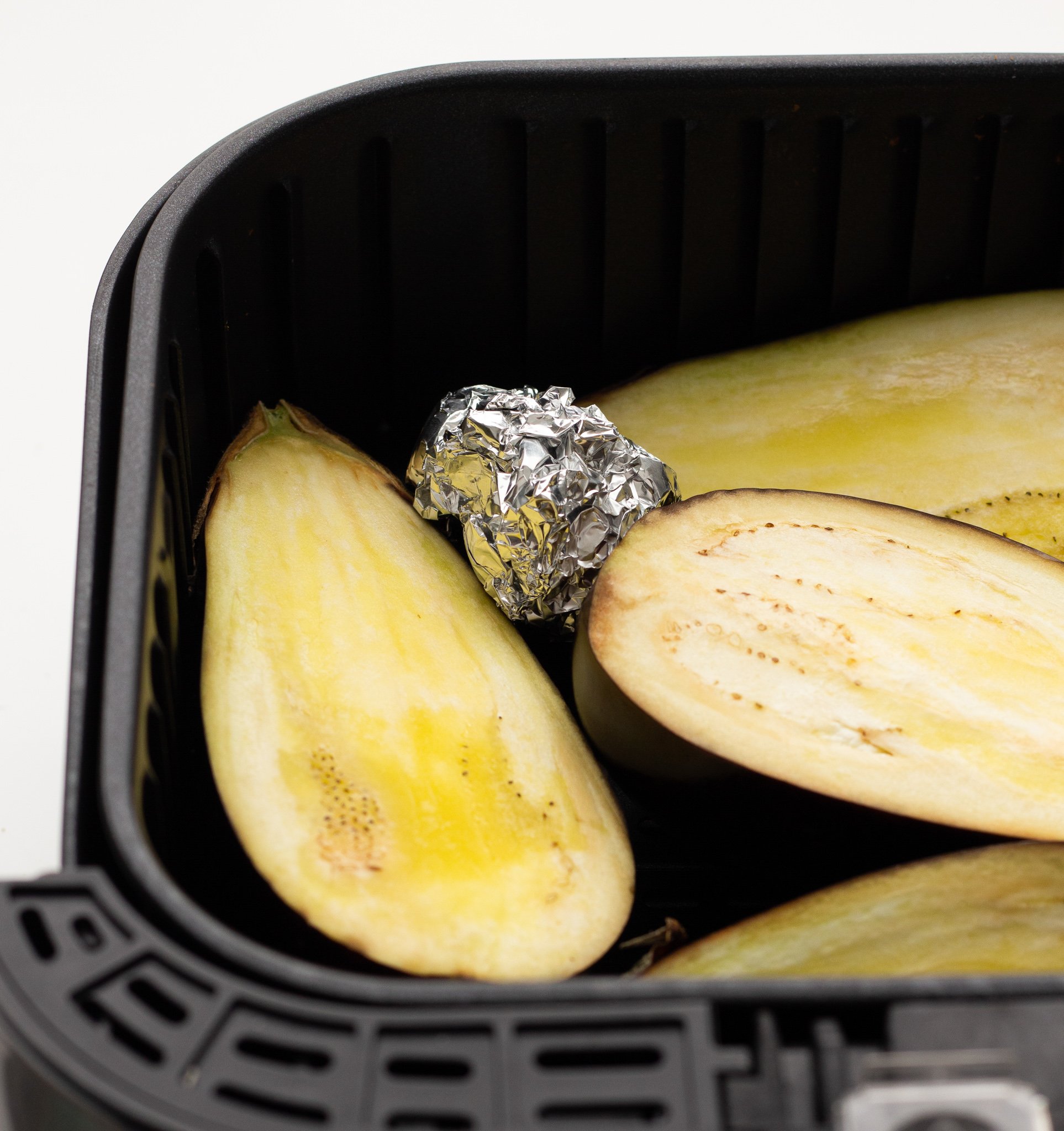 Air Fryer Eggplant with garlic in air fryer.