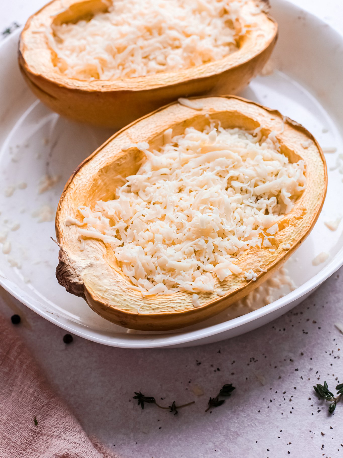 Baked Cheesy Spaghetti Squash Recipe with cheese on top. 