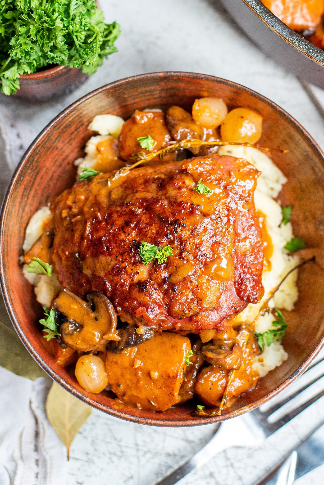 Coq au Vin Recipe in a tin bowl.