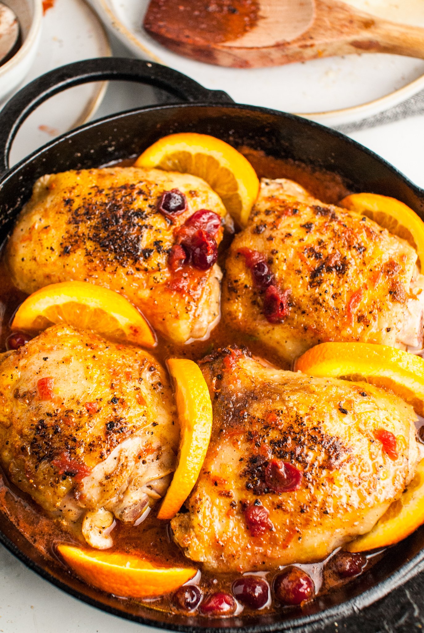Easy Baked Chicken Thighs with orange slices.