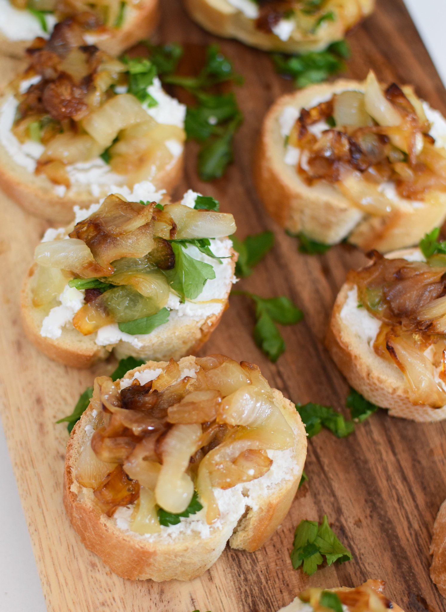 Beef Crostini with Caramelized Onion and Goat Cheese with onions. 