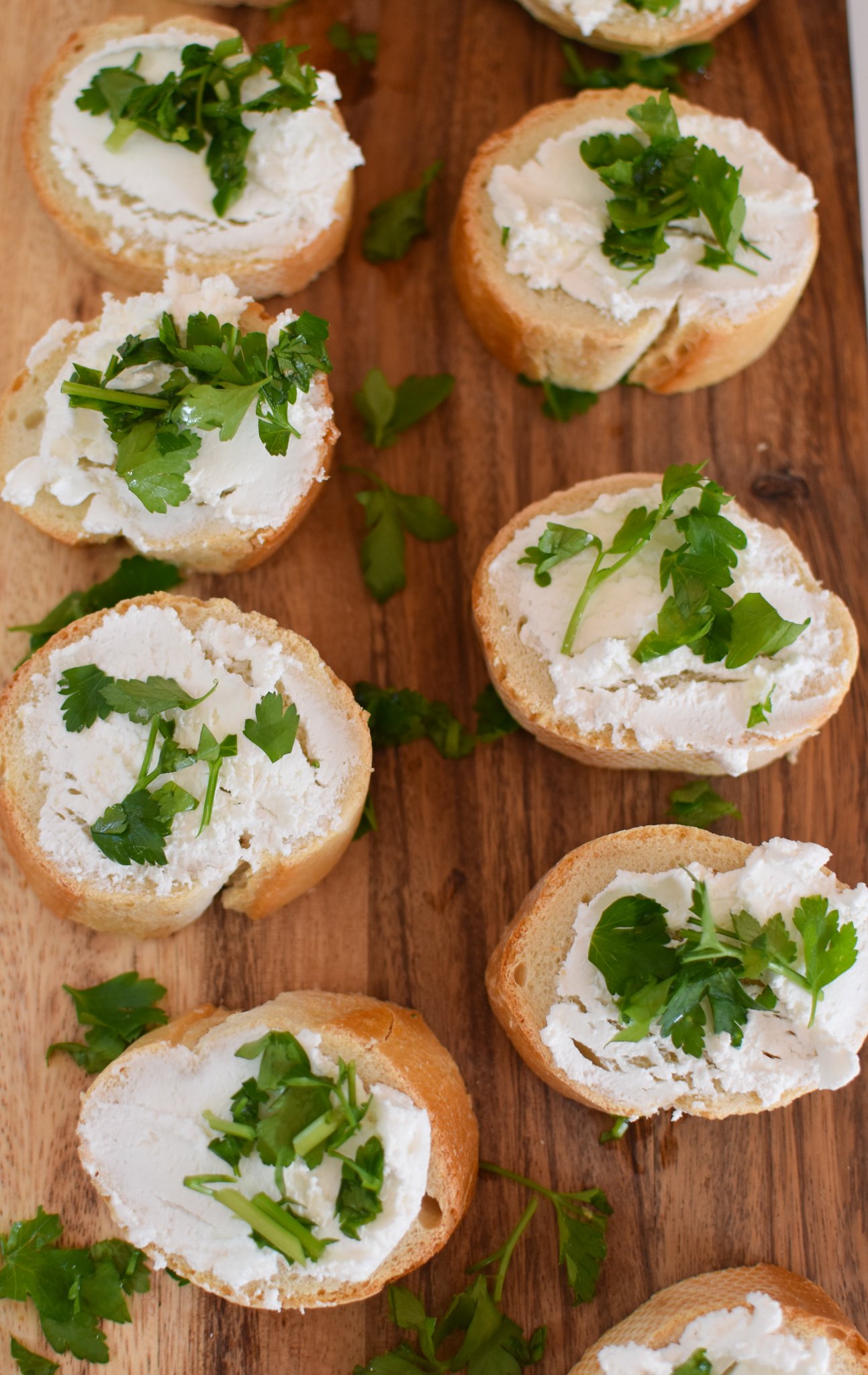 Beef Crostini with Caramelized Onion and Goat Cheese with parsley.