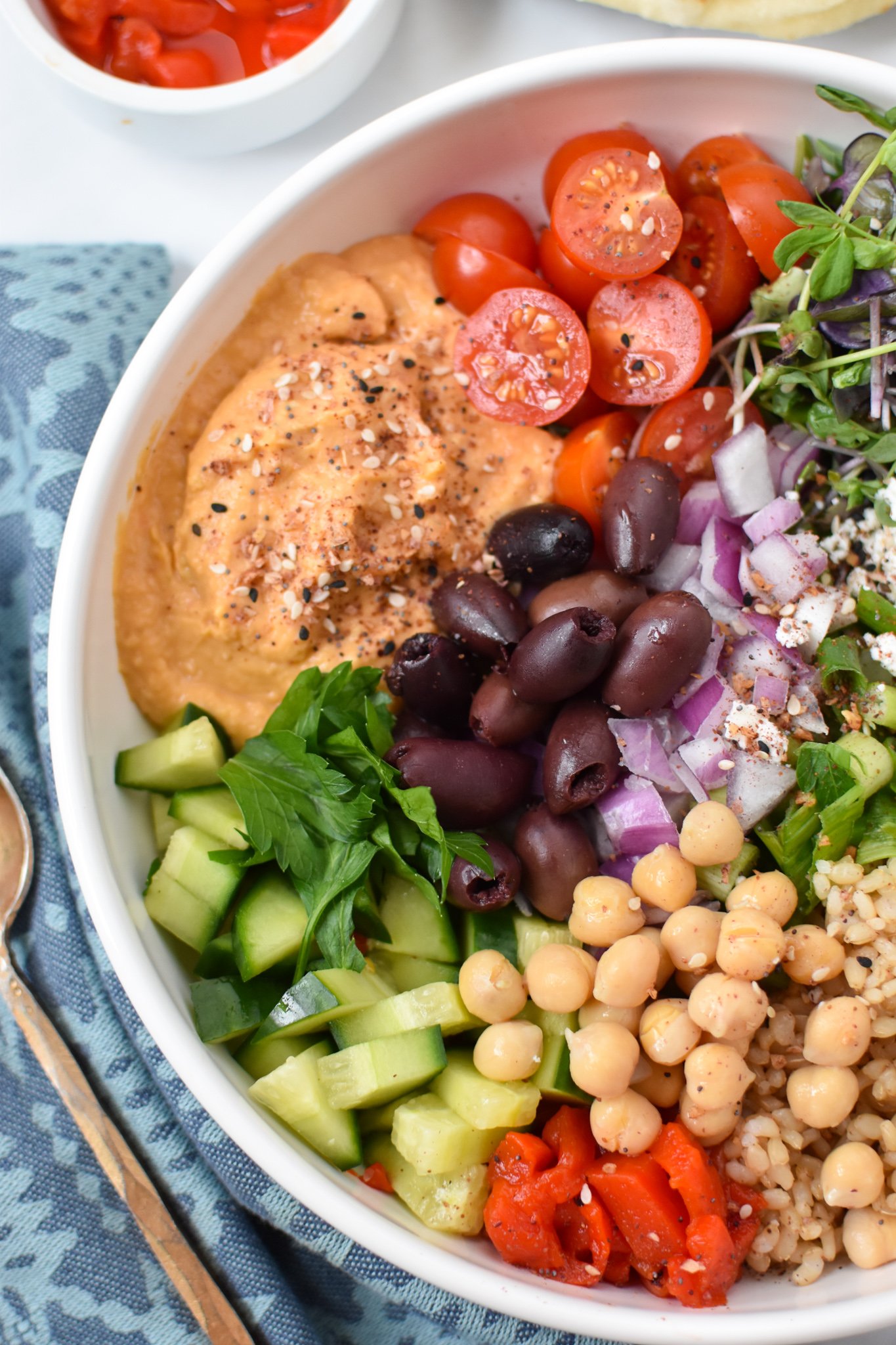 Easy Mediterranean Hummus Bowl with tomatoes. 