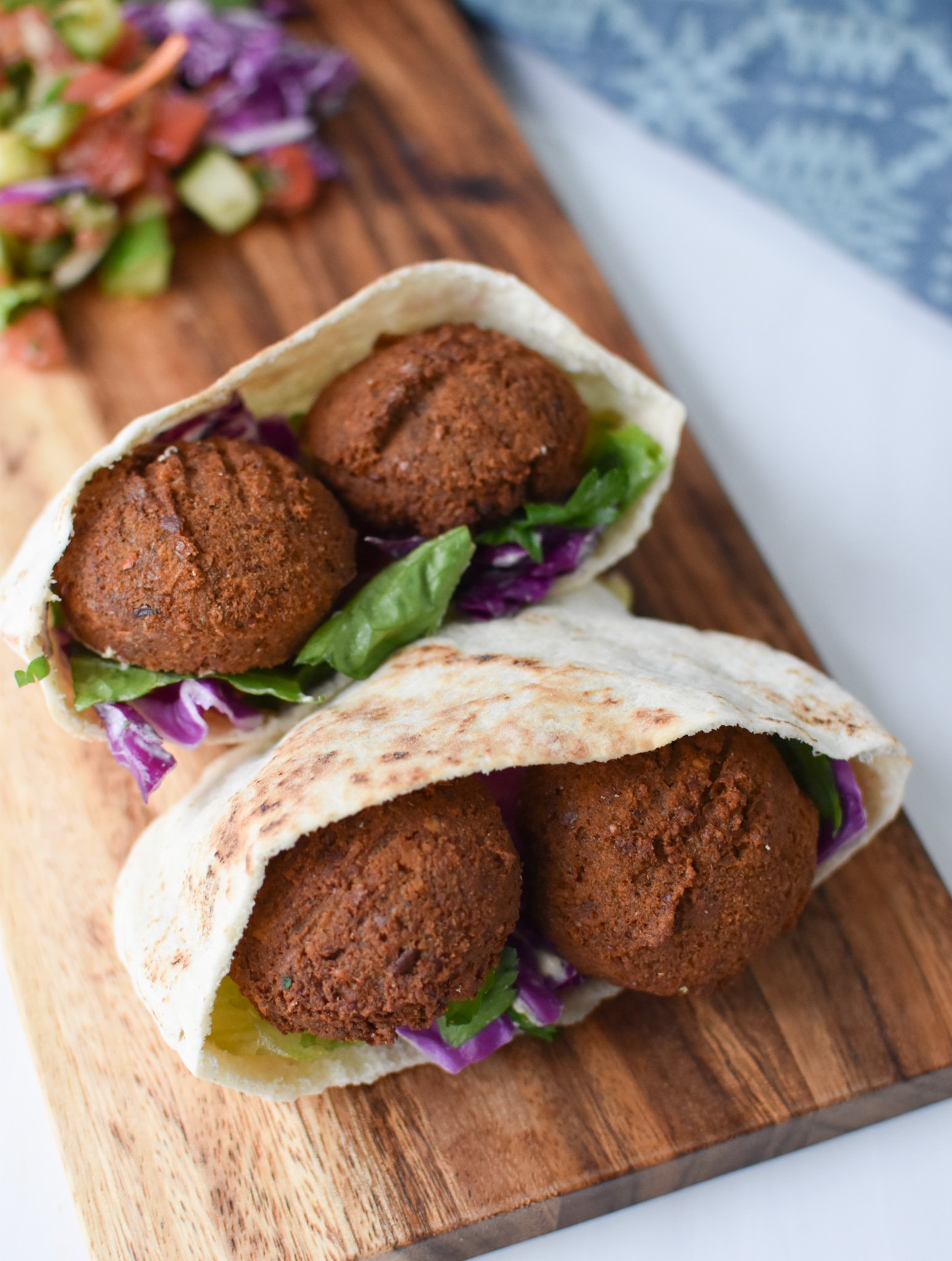 Falafel Sliders with Tahini Slaw on a cutting board. 