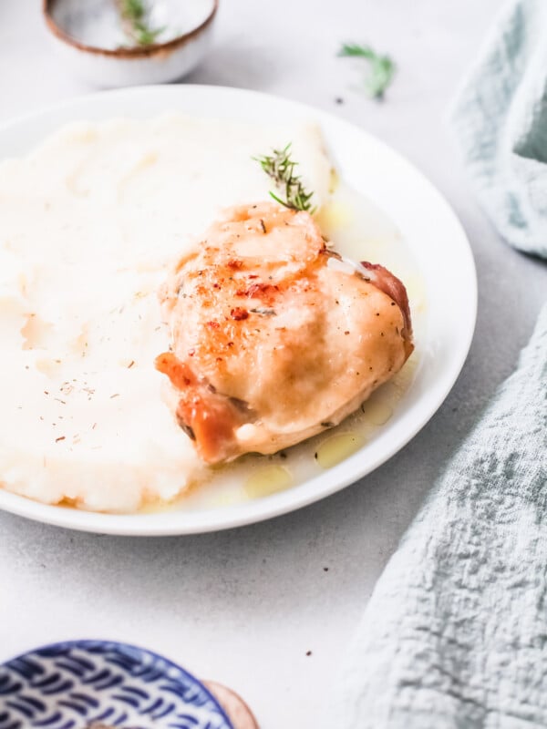 Instant Pot Creamy Rosemary Chicken on a white plate.