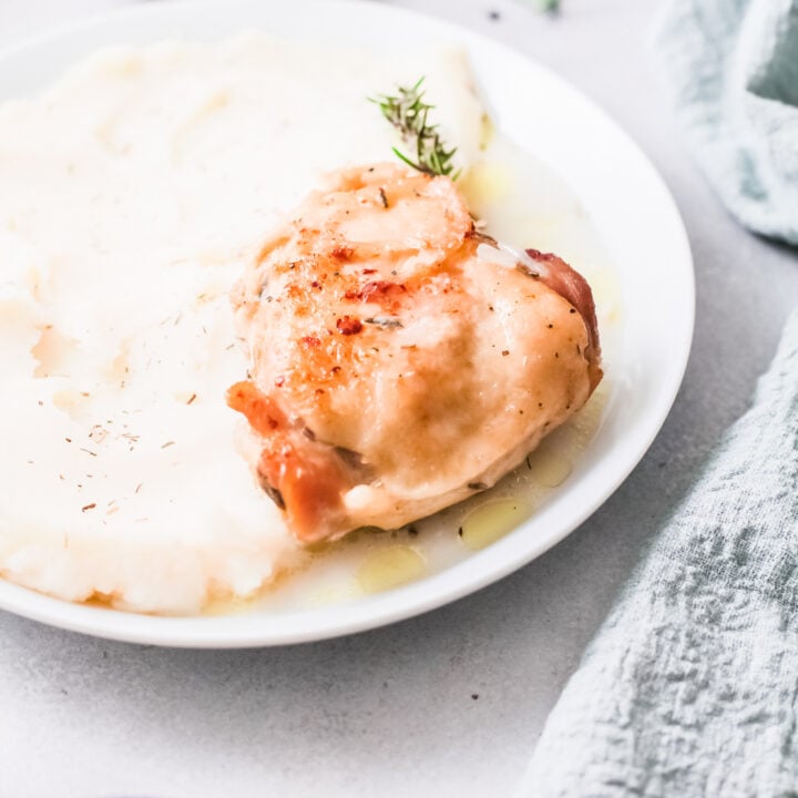 Instant Pot Creamy Rosemary Chicken on a white plate.
