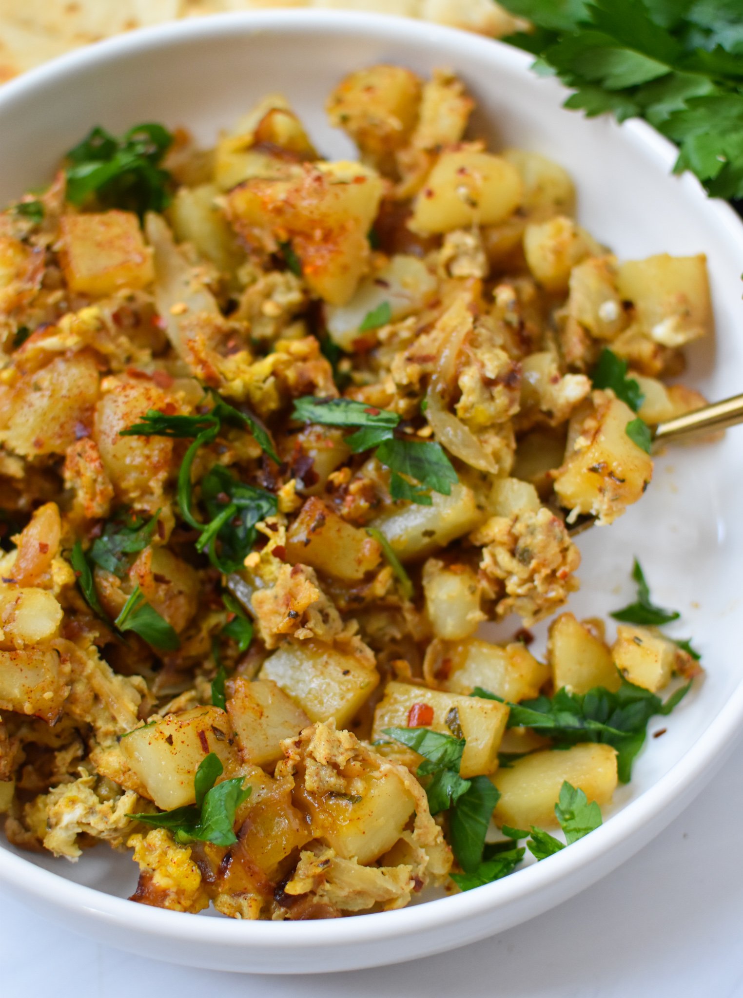 Lebanese Potato and Egg Recipe in a white bowl.