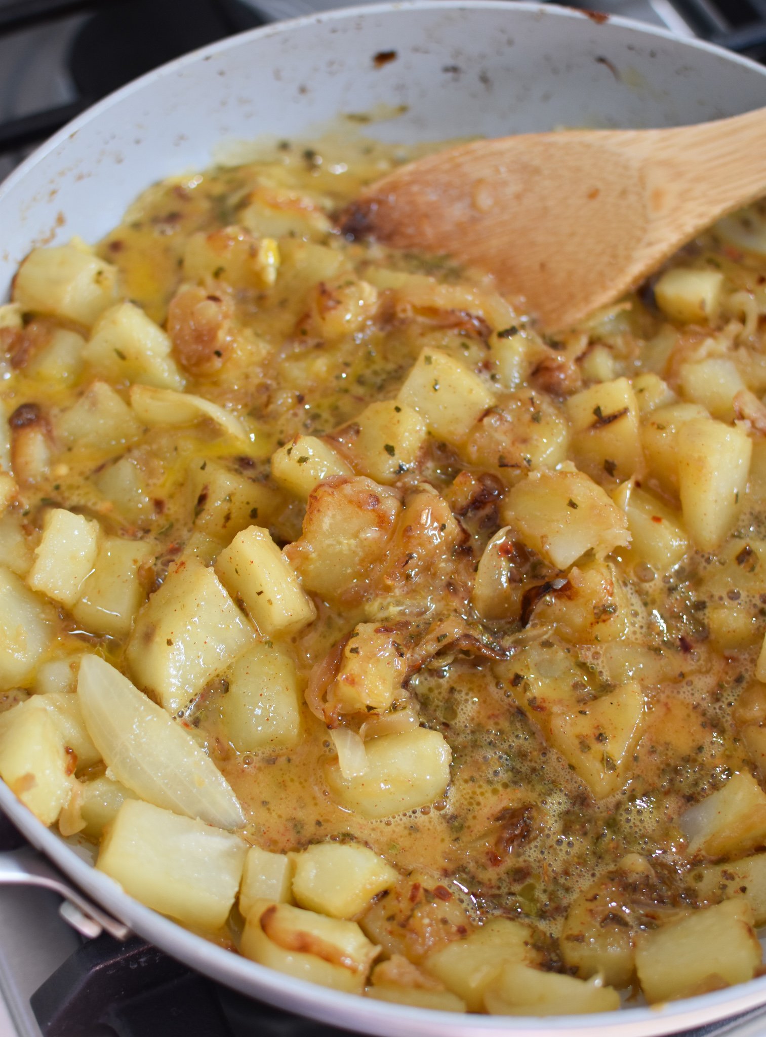 Lebanese Potato and Egg Recipe with eggs in skillet. 