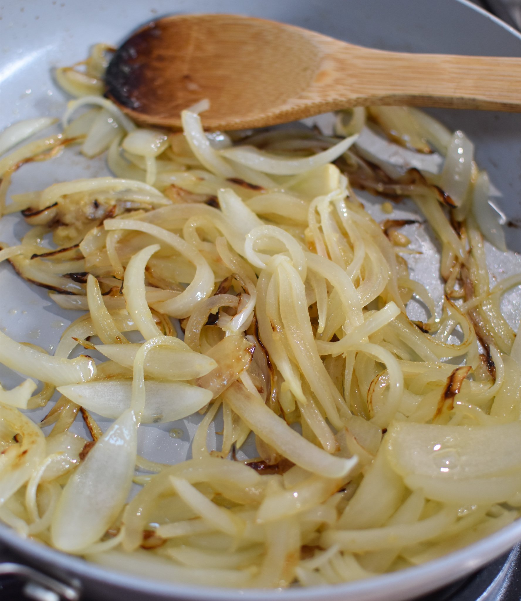 Lebanese Potato and Egg Recipe onions in a skillet.