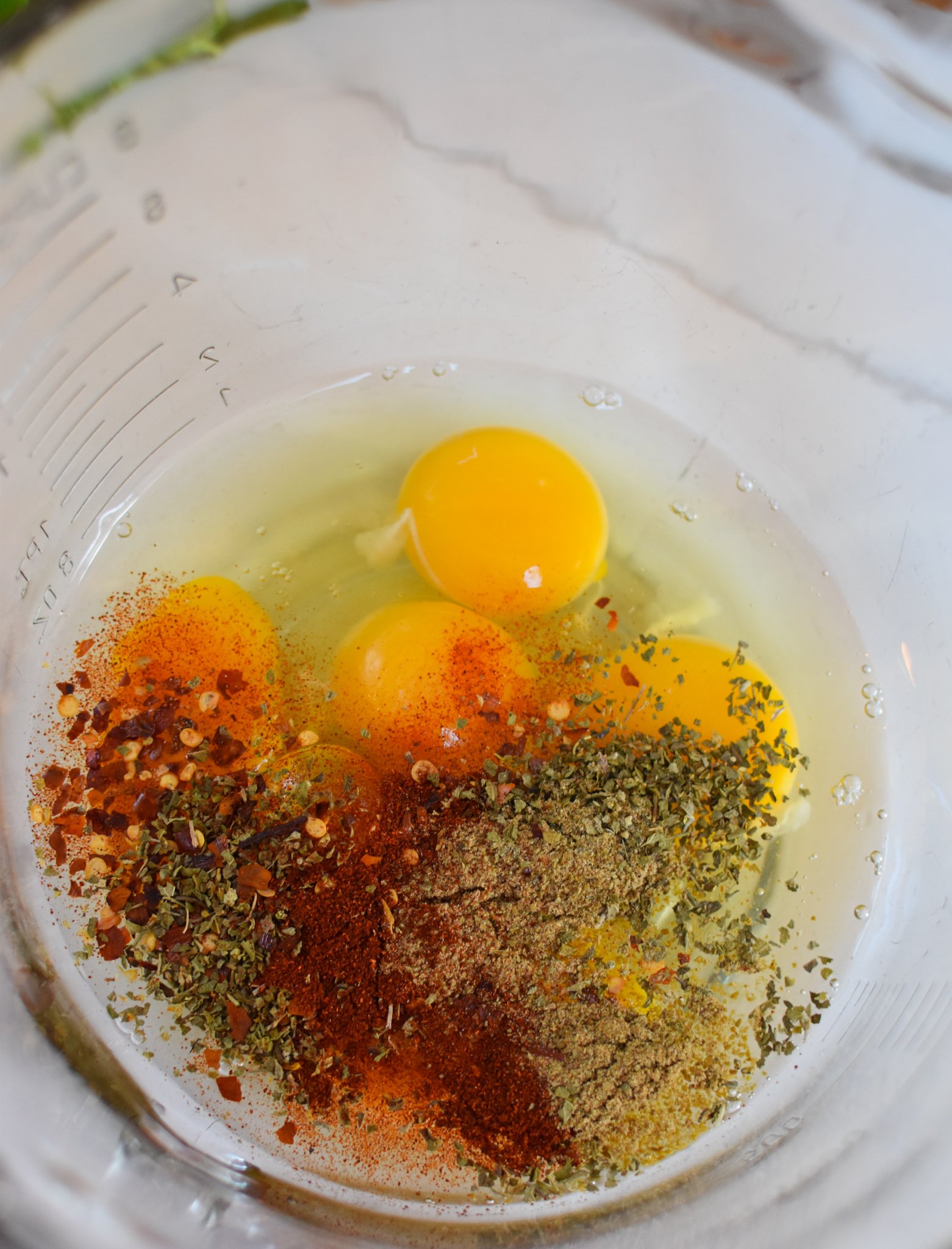 Lebanese Potato and Egg Recipe eggs and spices in a bowl.
