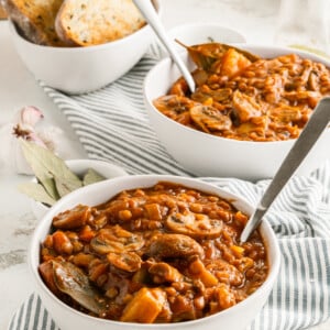 Lentil Mushroom Stew in two white bowls.