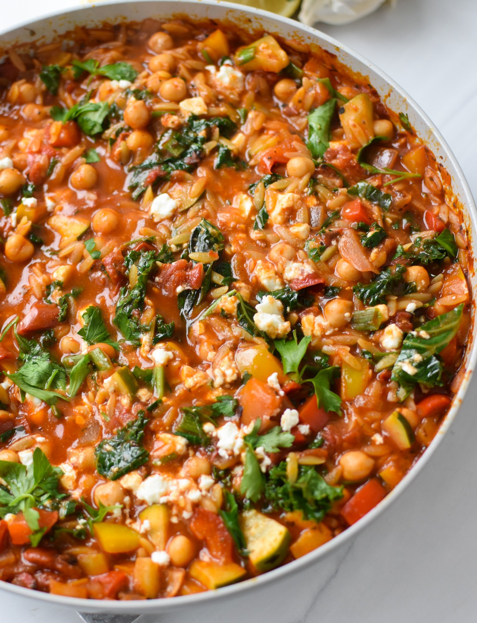 Mediterranean Orzo Pasta Recipe in a skillet. 