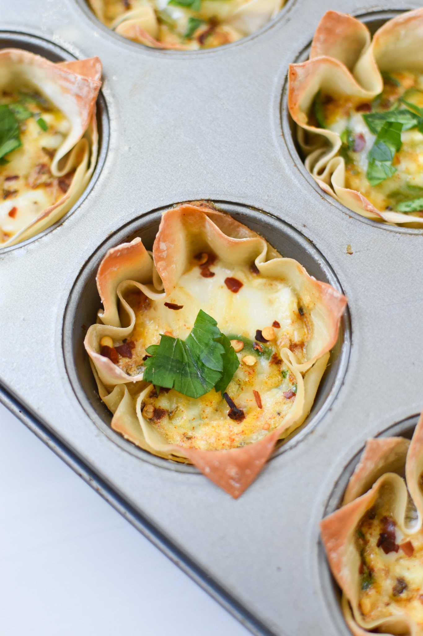 Mediterranean Quiche Wontons with parsley. 