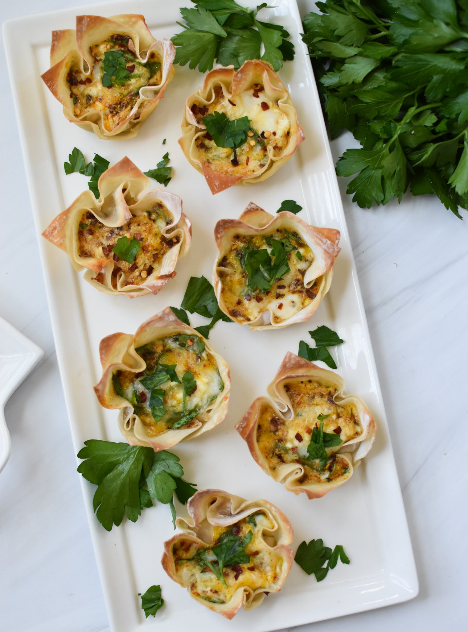Mediterranean Quiche Wontons with parsley and cheese.