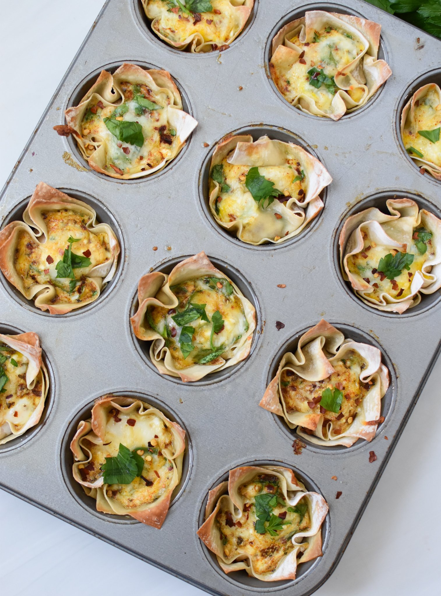 Mediterranean Quiche Wontons in muffin tins.