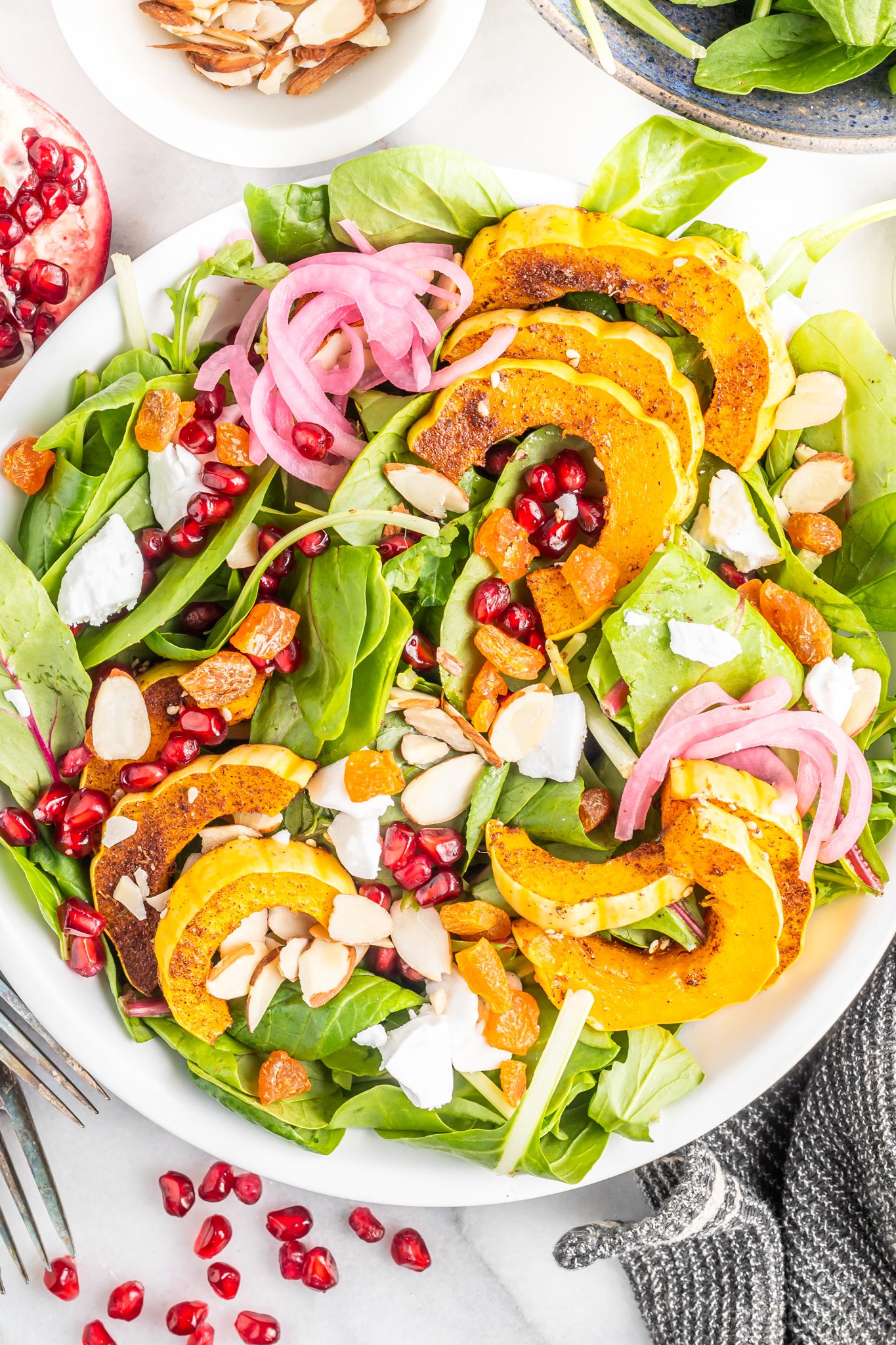 Za'atar Roasted Delicata Squash with pomegranate seeds.