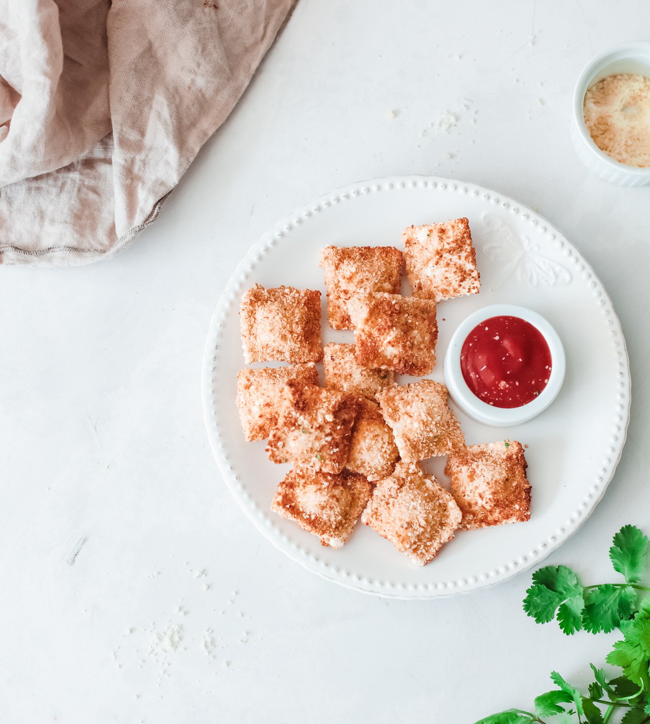 Air Fried Ravioli with parsley and napkin.