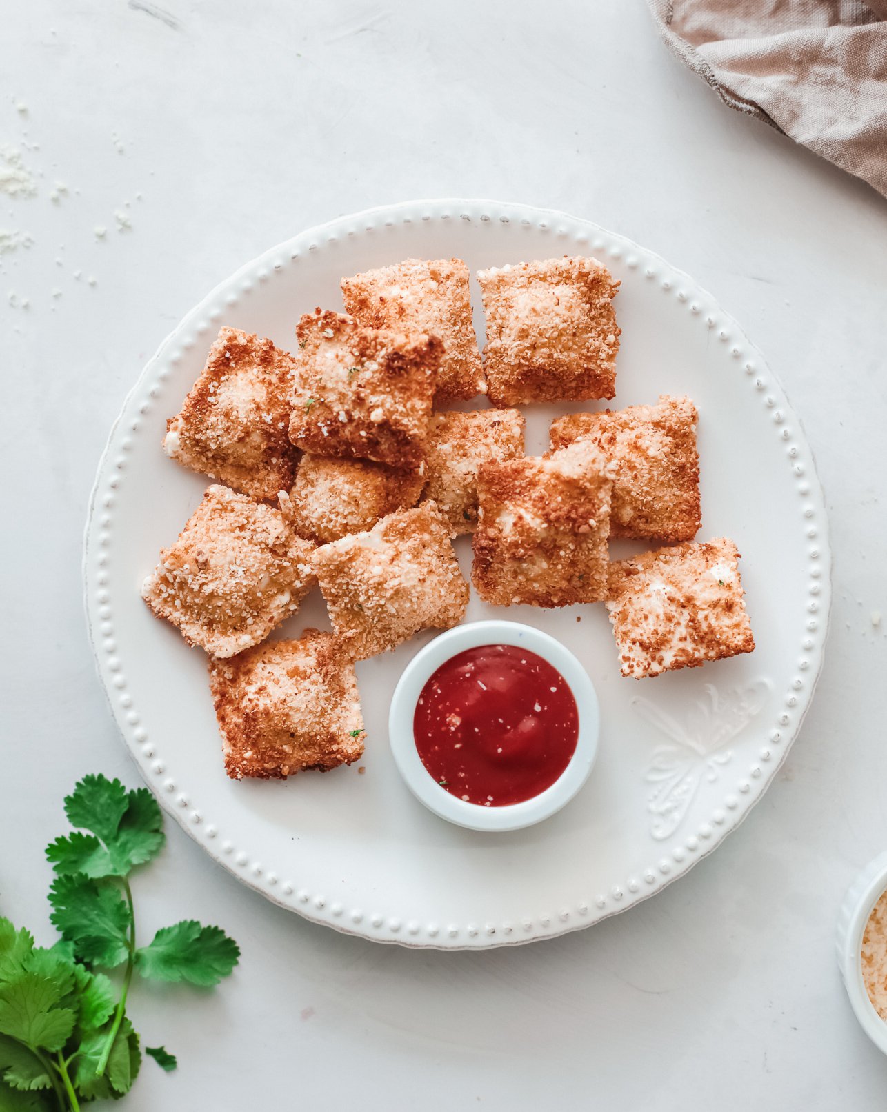 Air Fried Ravioli on a white plate.