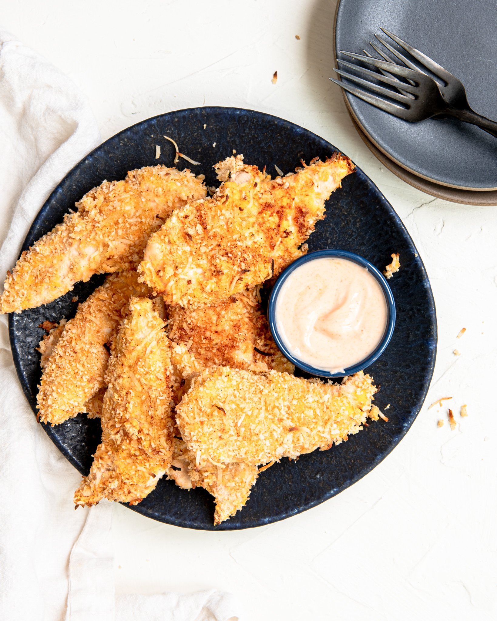 Air Fryer Coconut Chicken Tenders with honey sauce.