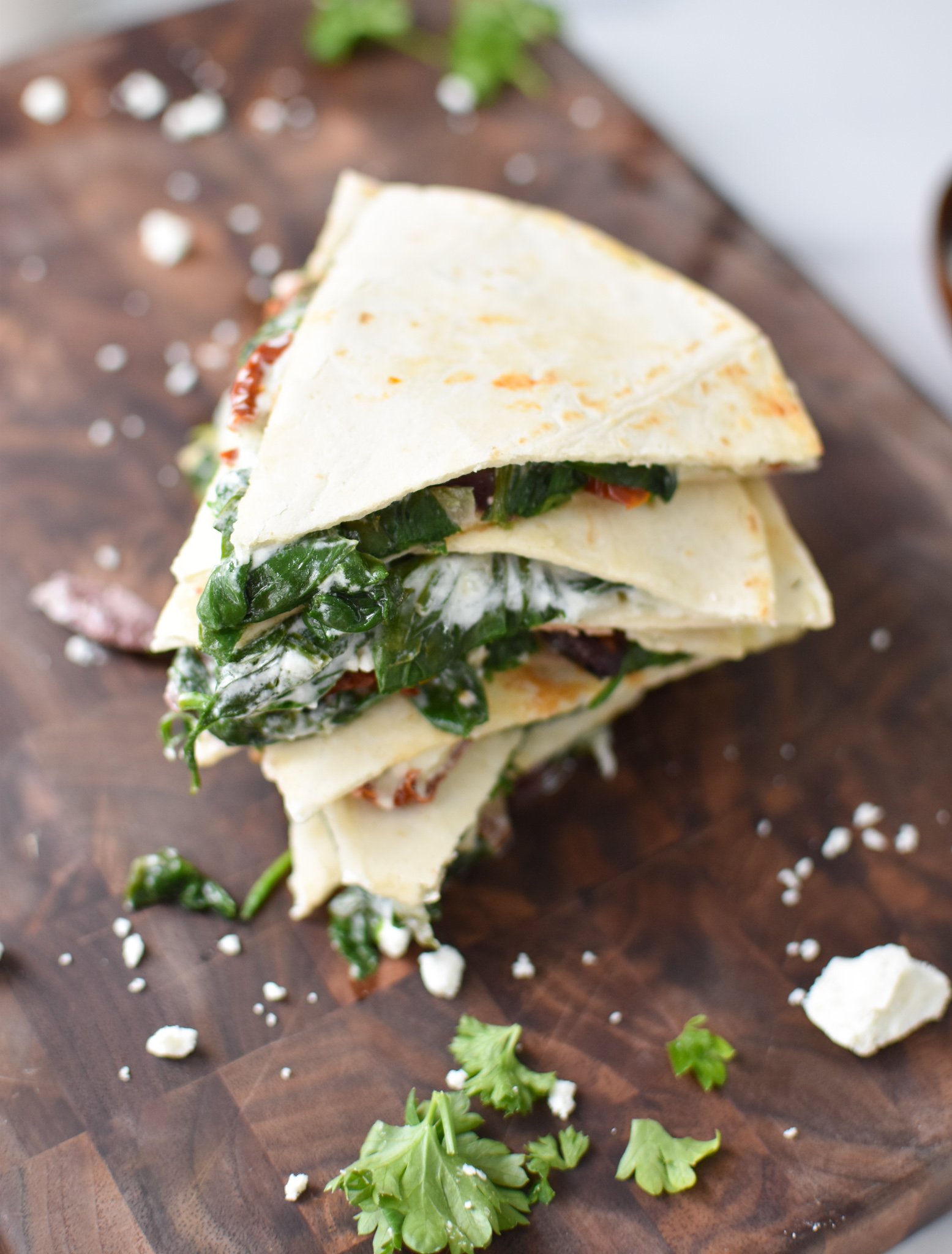 Easy Vegetarian Quesadilla Recipe on a cutting board.