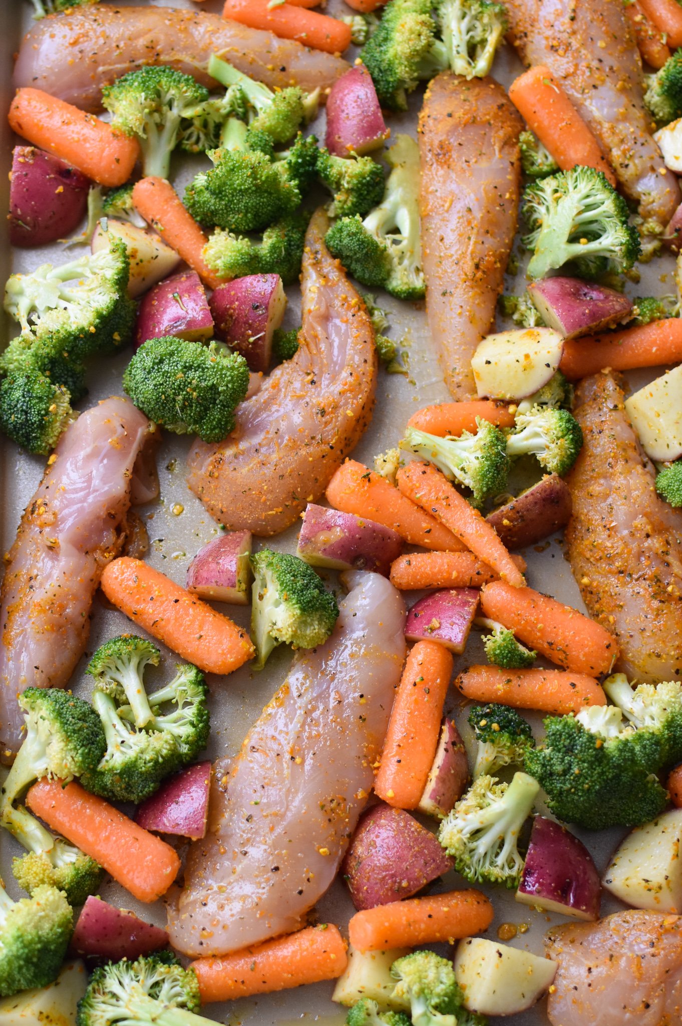 Sheet Pan Lemon Parmesan Chicken Tenders on a baking sheet. 