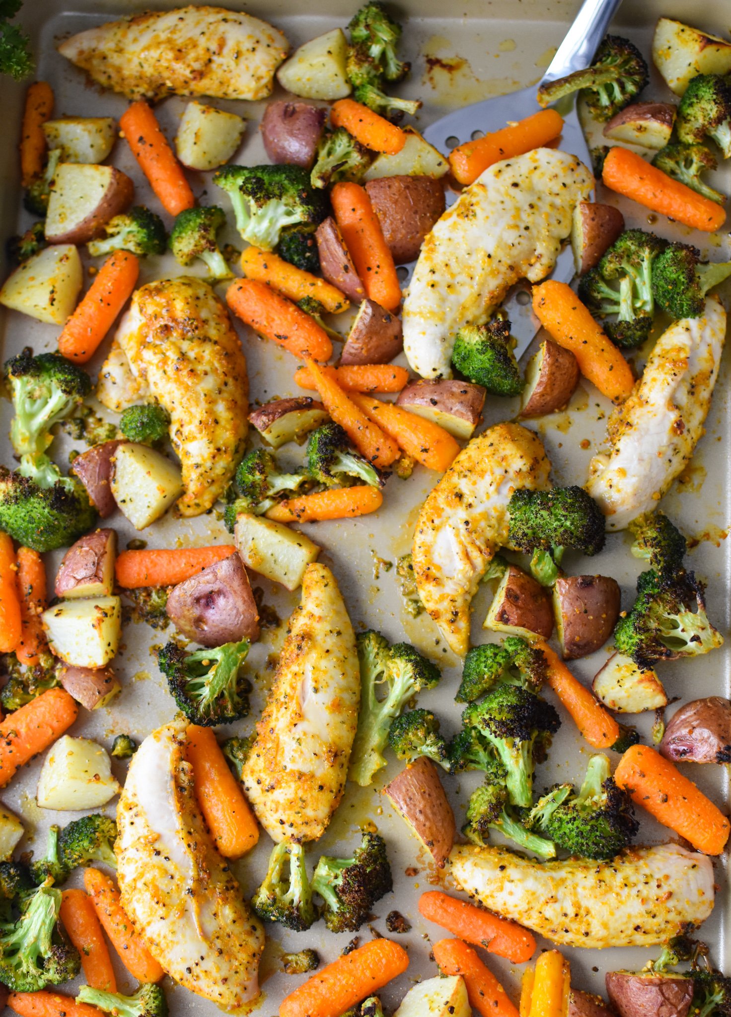 Sheet Pan Lemon Parmesan Chicken Tenders on a baking sheet.