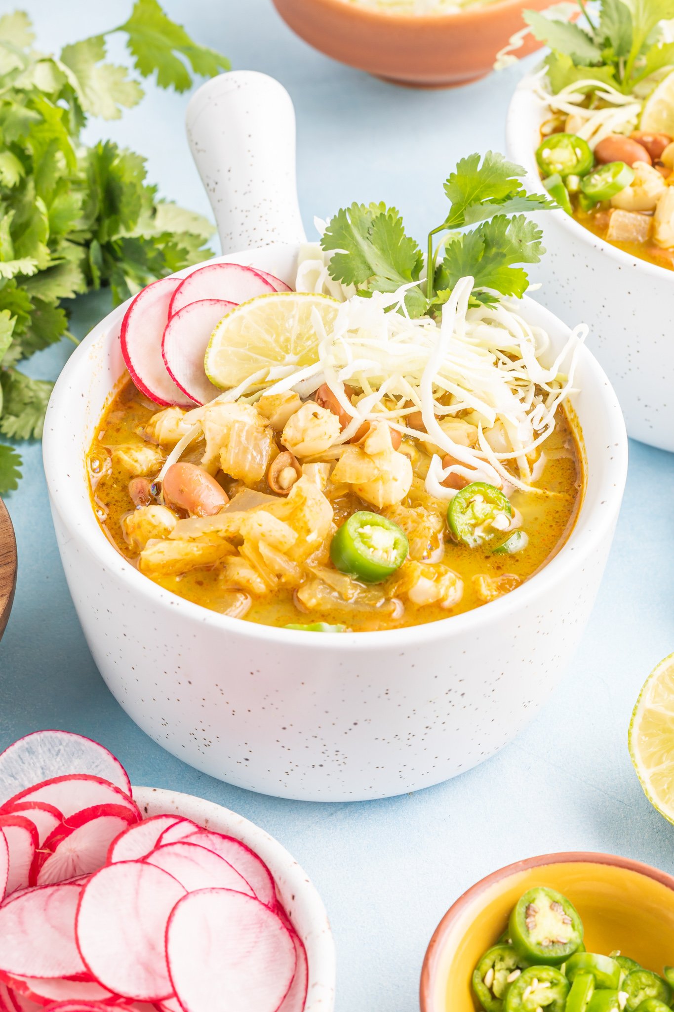 Vegan Pinto Bean Soup in a white bowl. 