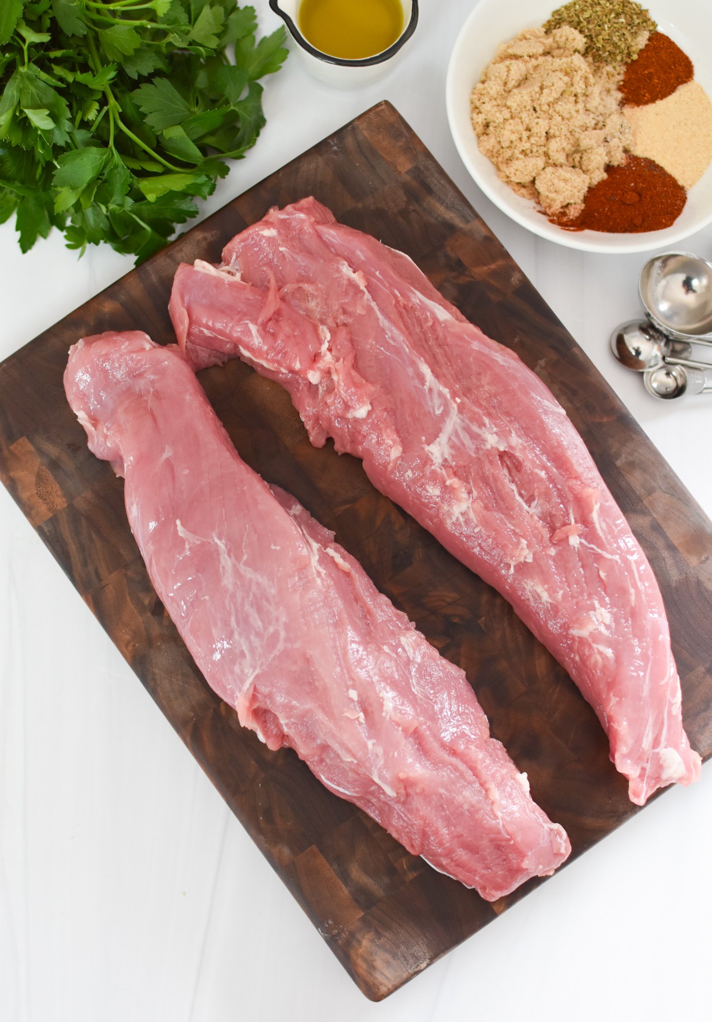 Air Fryer Pork Tenderloin on a cutting board.