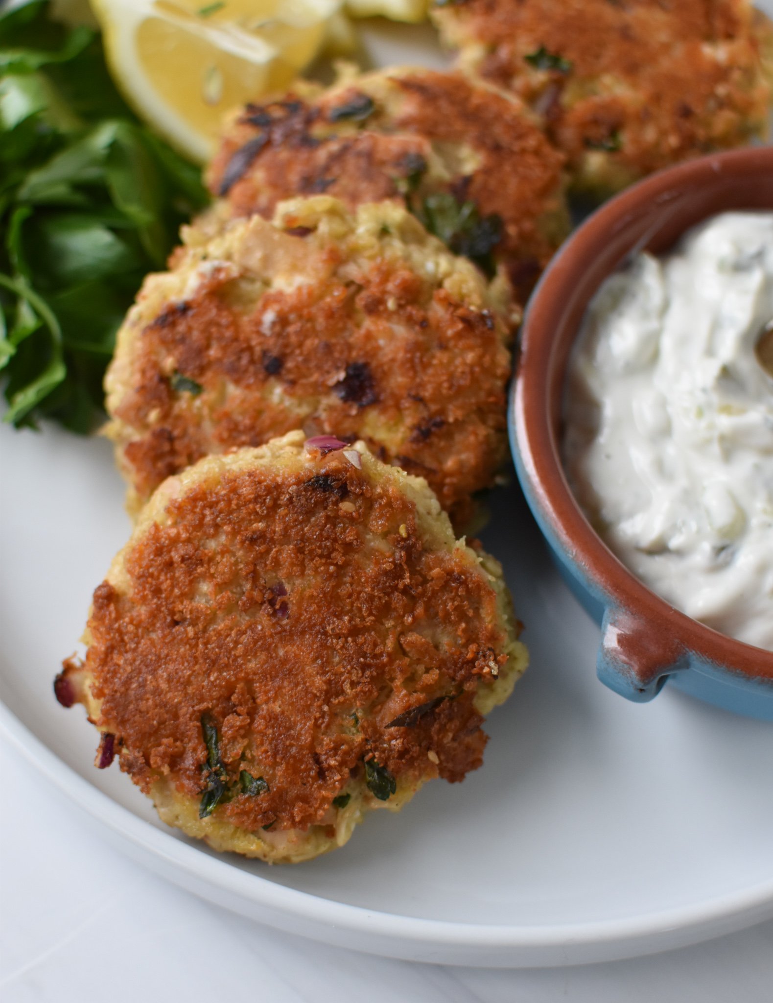 Mediterranean Tuna Patties with tzatziki sauce.