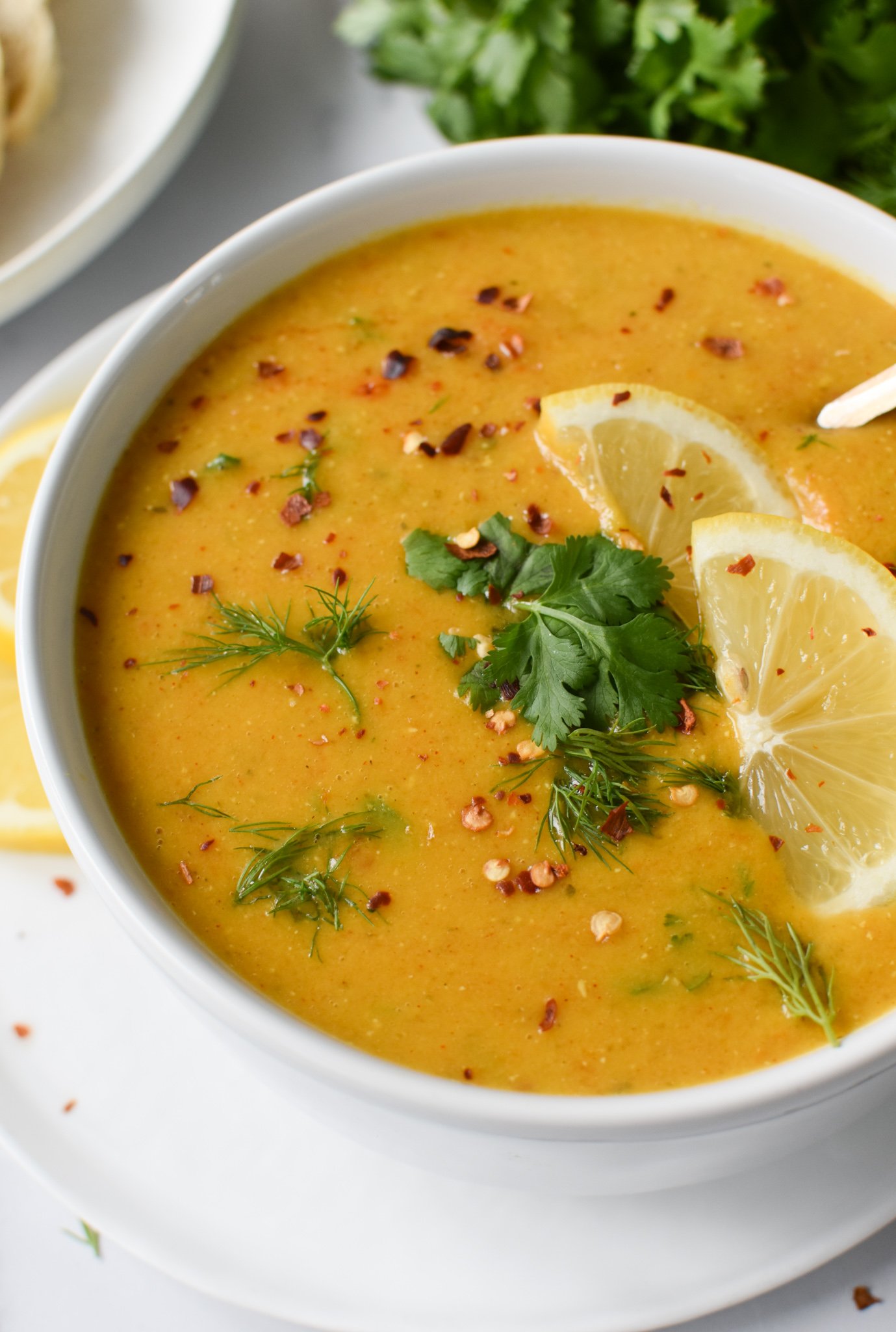Lemon Lentil Soup Recipe with lemon wedges.