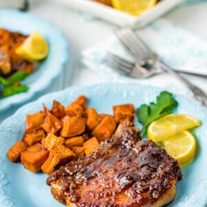 Maple Bourbon Pork Chops Recipe on a blue plate.