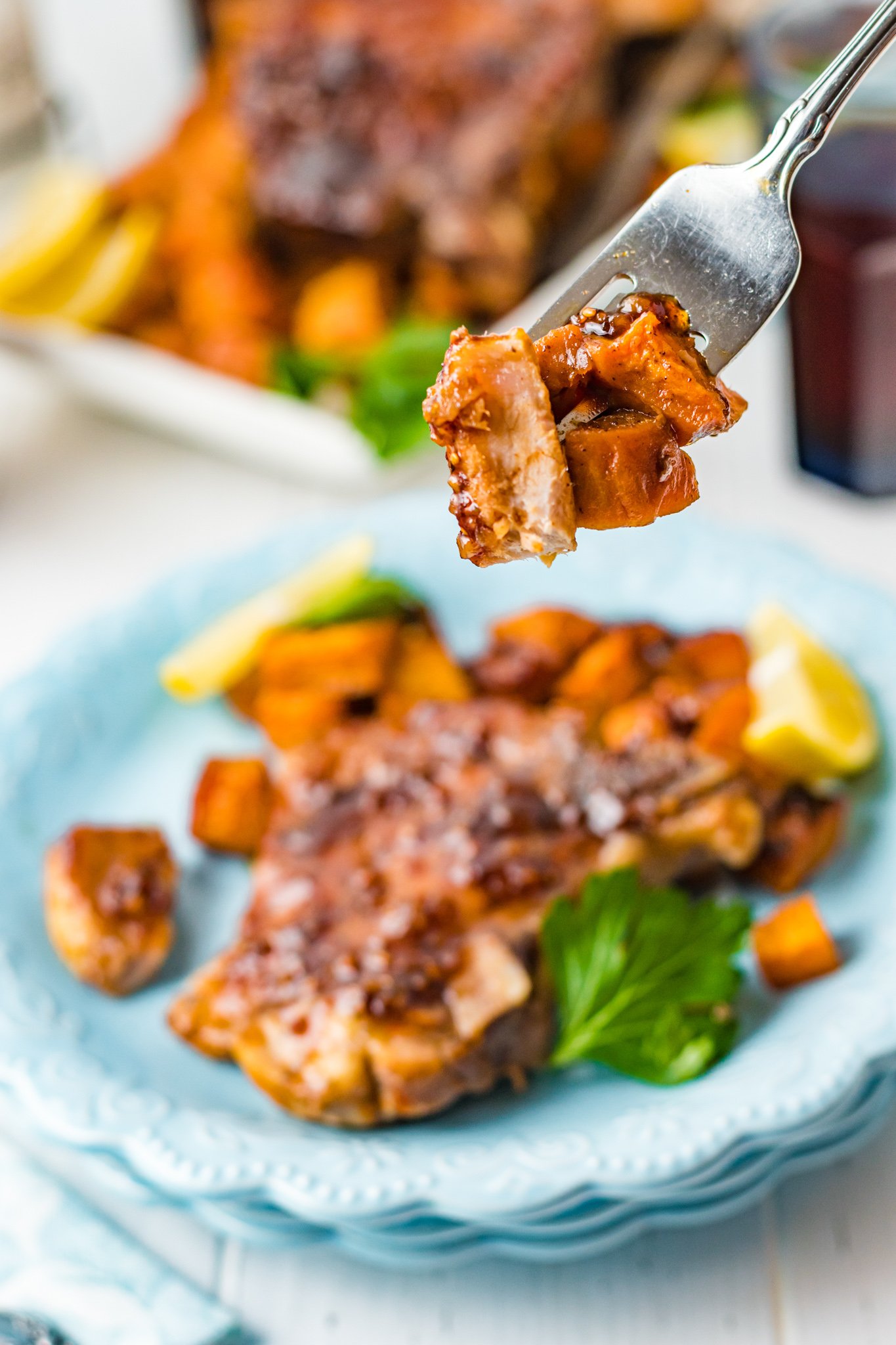 Maple Bourbon Pork Chops Recipe pork on a fork.