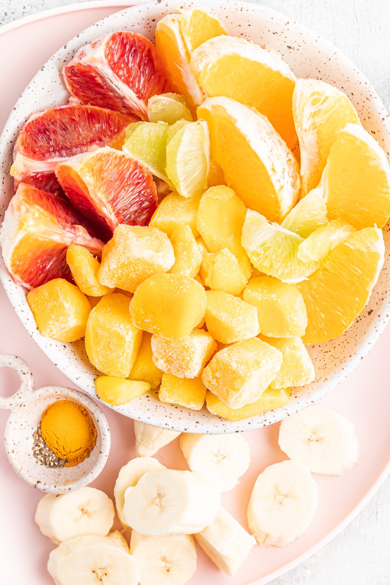  Orange Smoothie Recipe ingredients in a bowl. 