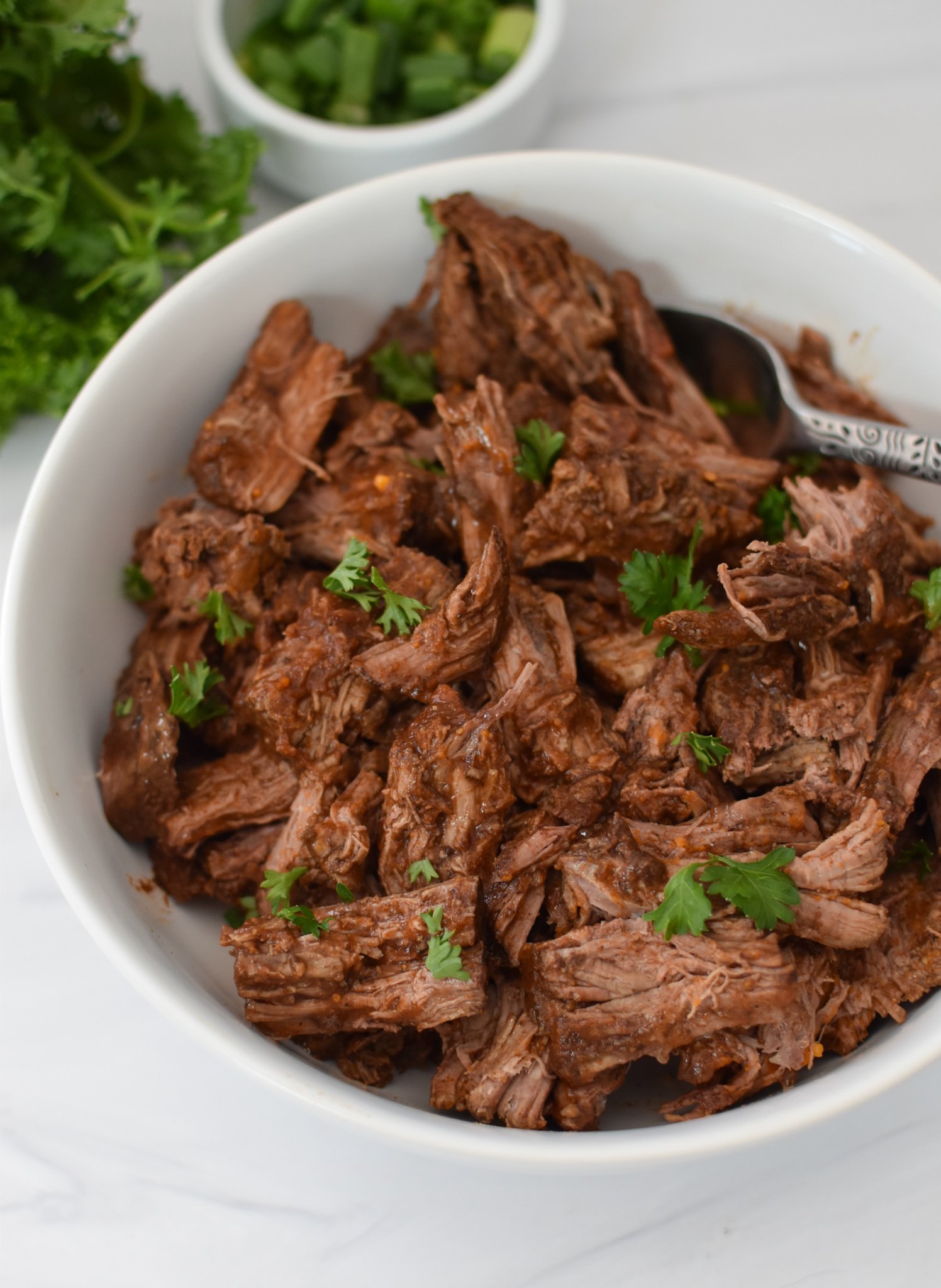 Slow Cooker Shredded Beef Hummus Bowls beef in a bowl. 