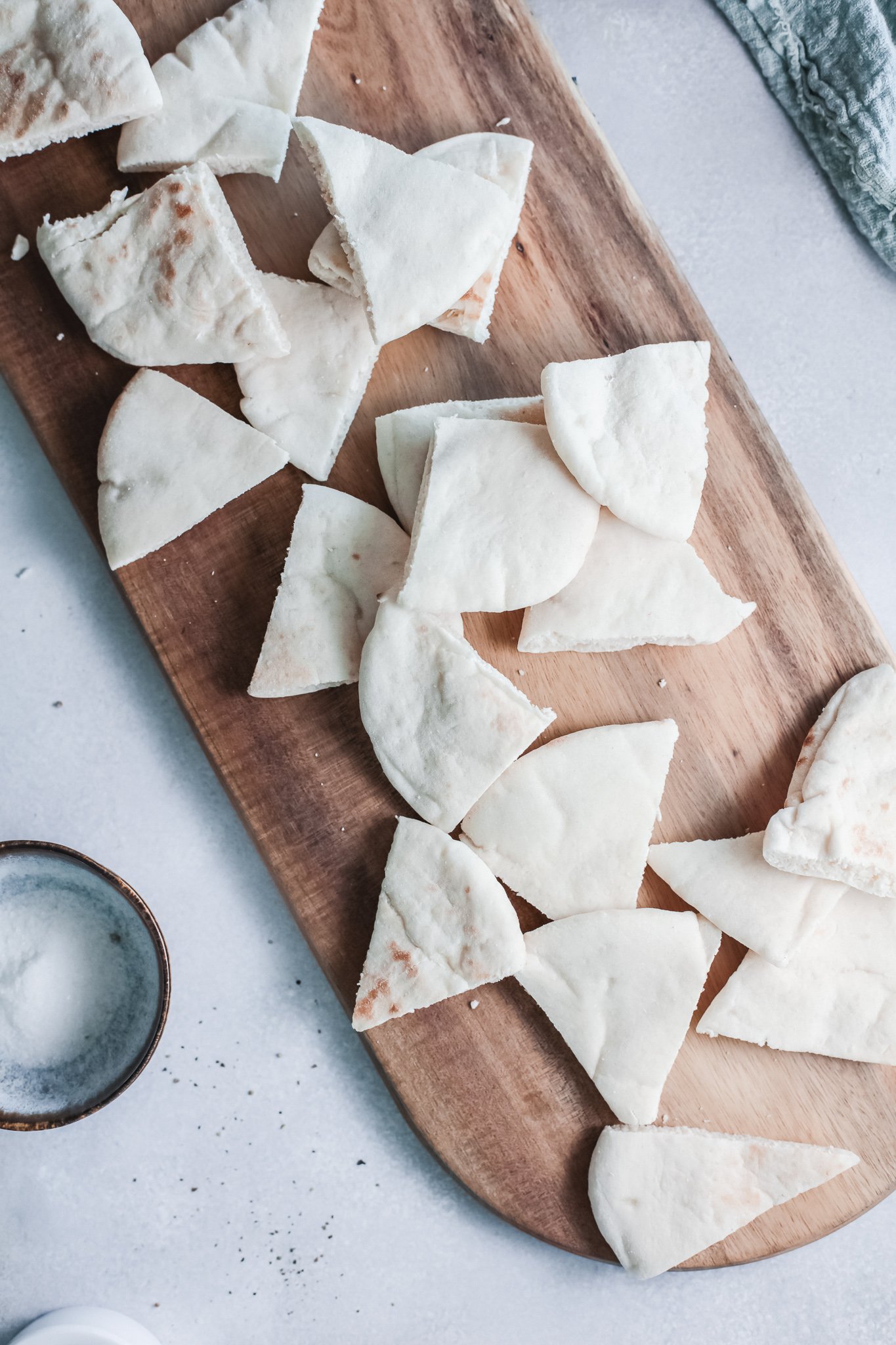 Air Fryer Pita Chips on a cutting board. 